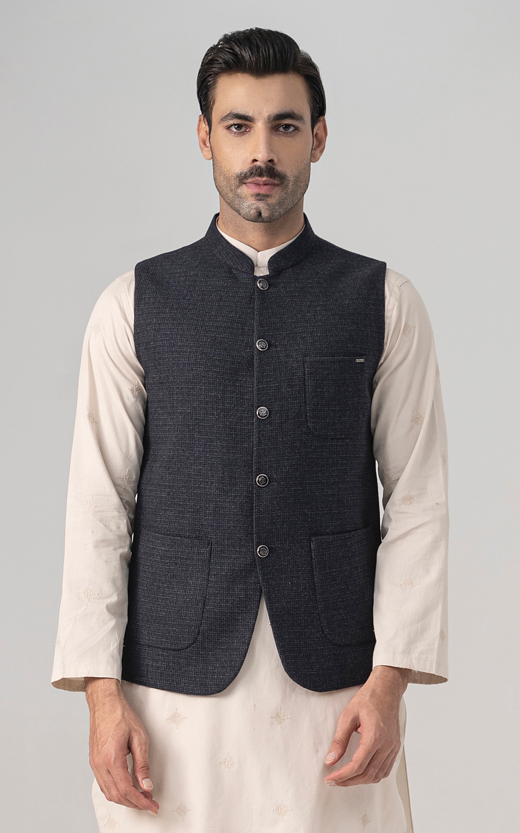 Navy textured wool-blend waistcoat with four-button front and welt pockets