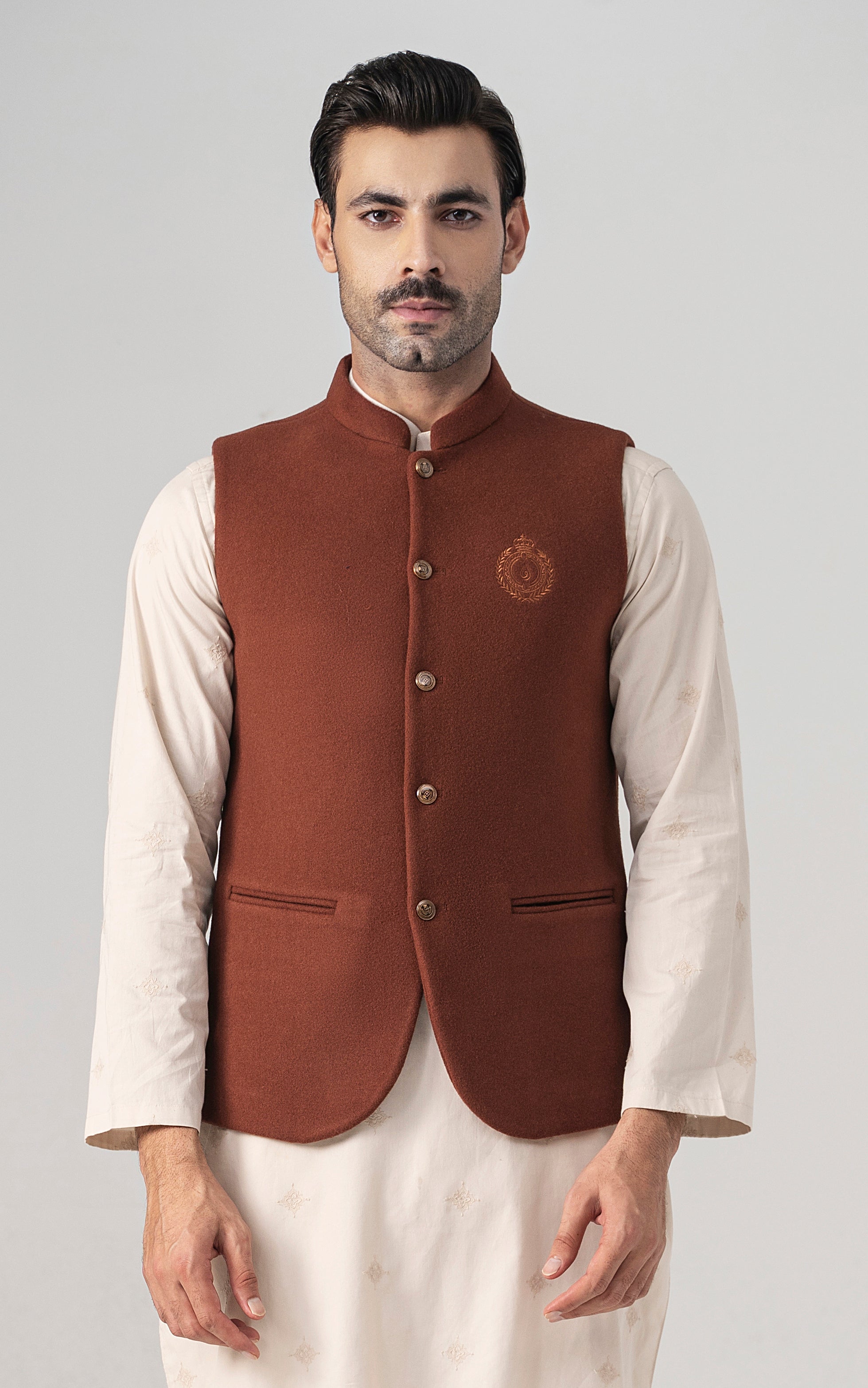 Rust wool-blend waistcoat with stand collar, front buttons, and welt pockets