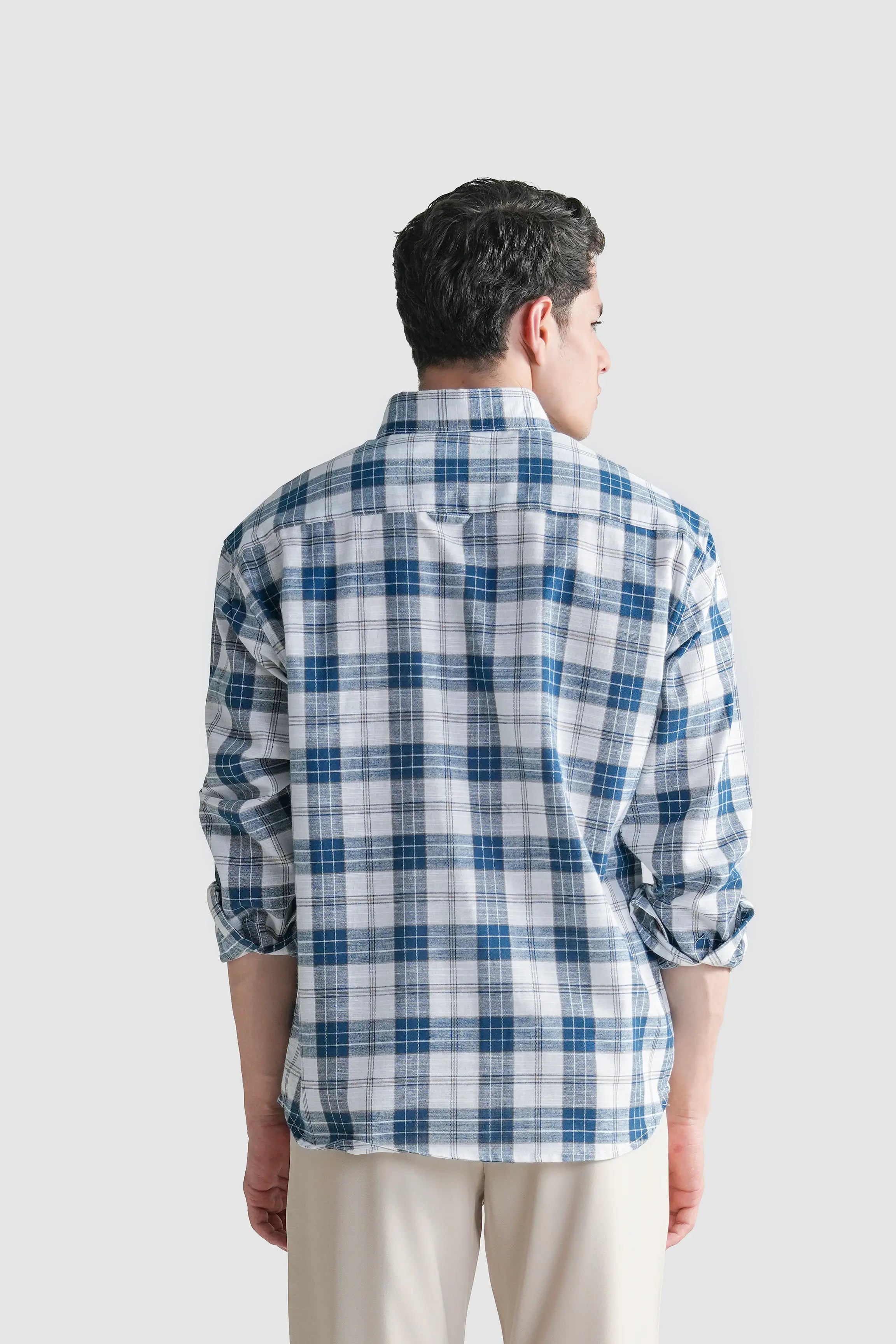 Blue and white plaid button-up shirt, back view with long sleeves