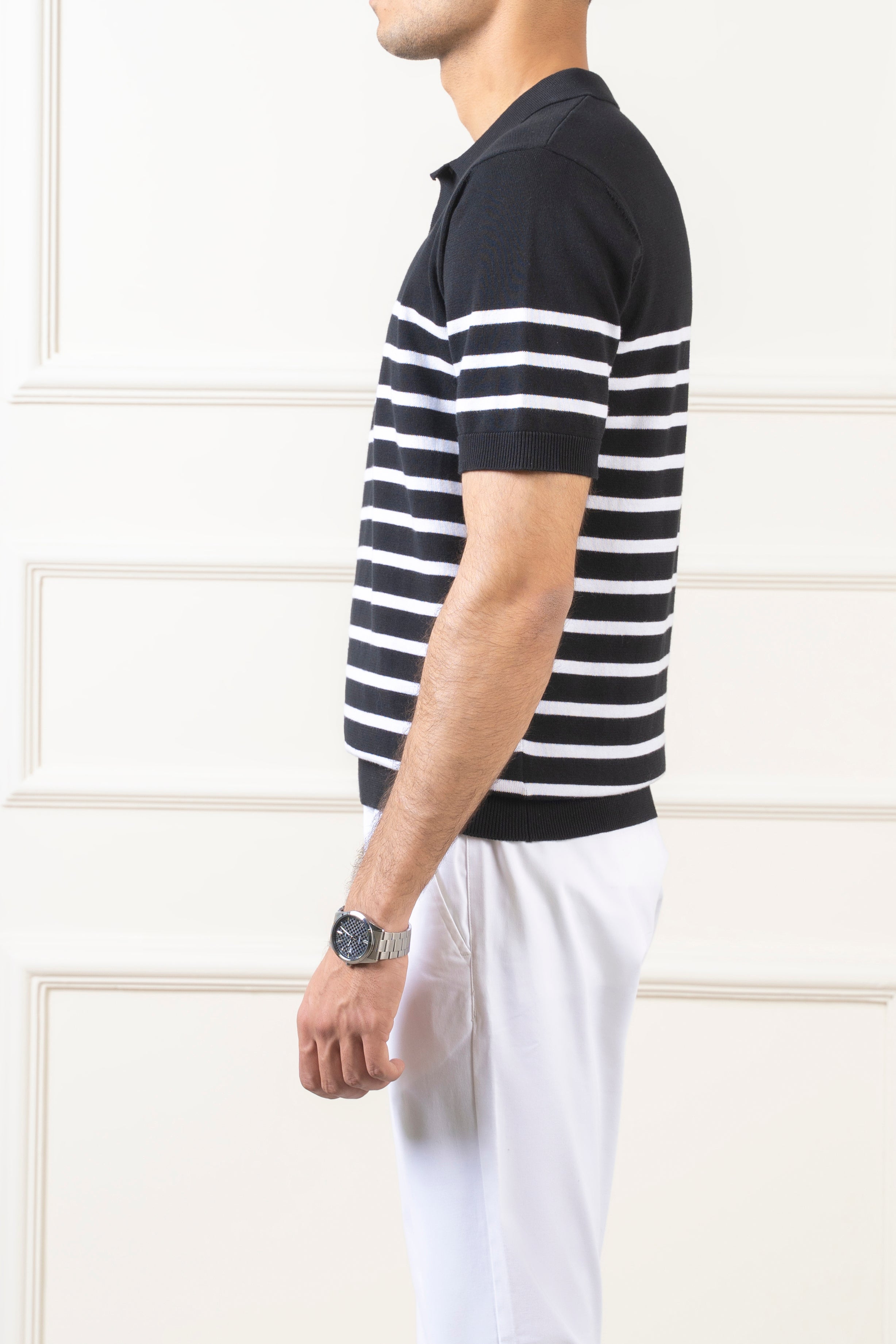 Men's striped knit polo sweater with short sleeves, shown in side profile.
