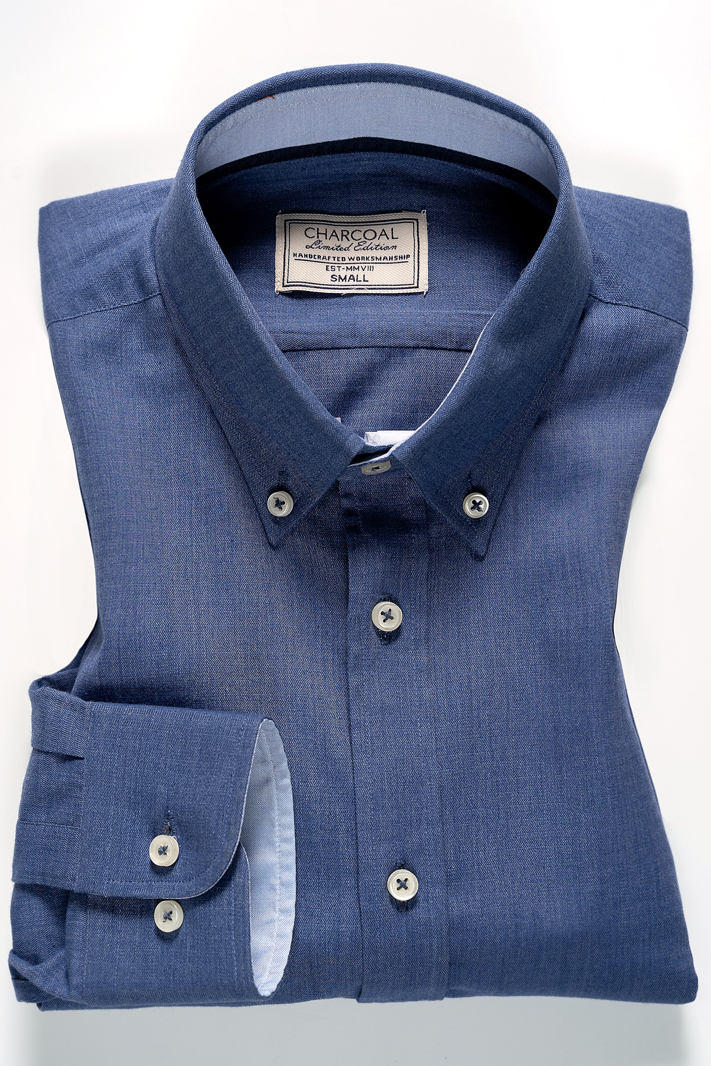 Blue button-up shirt with button front and chest pocket