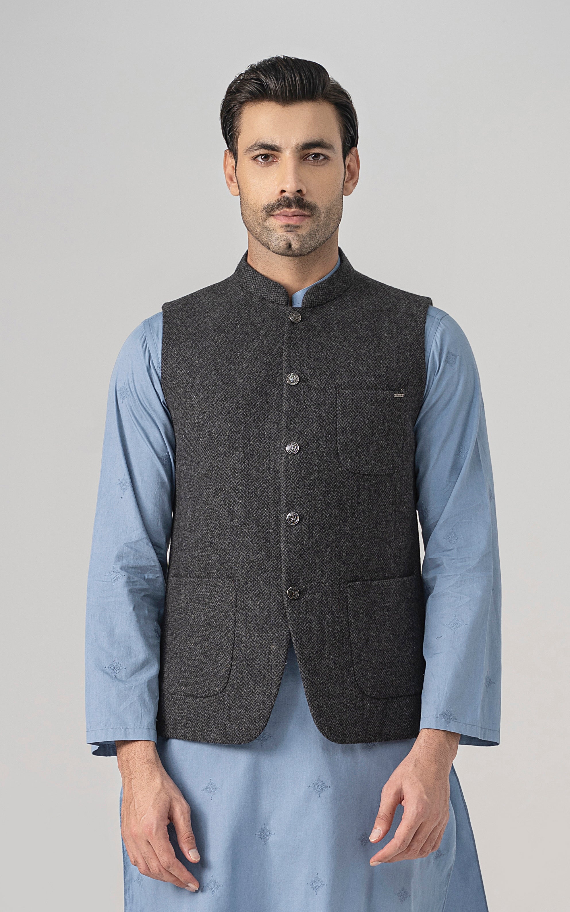 Grey textured wool-blend waistcoat with button front and two patch pockets.