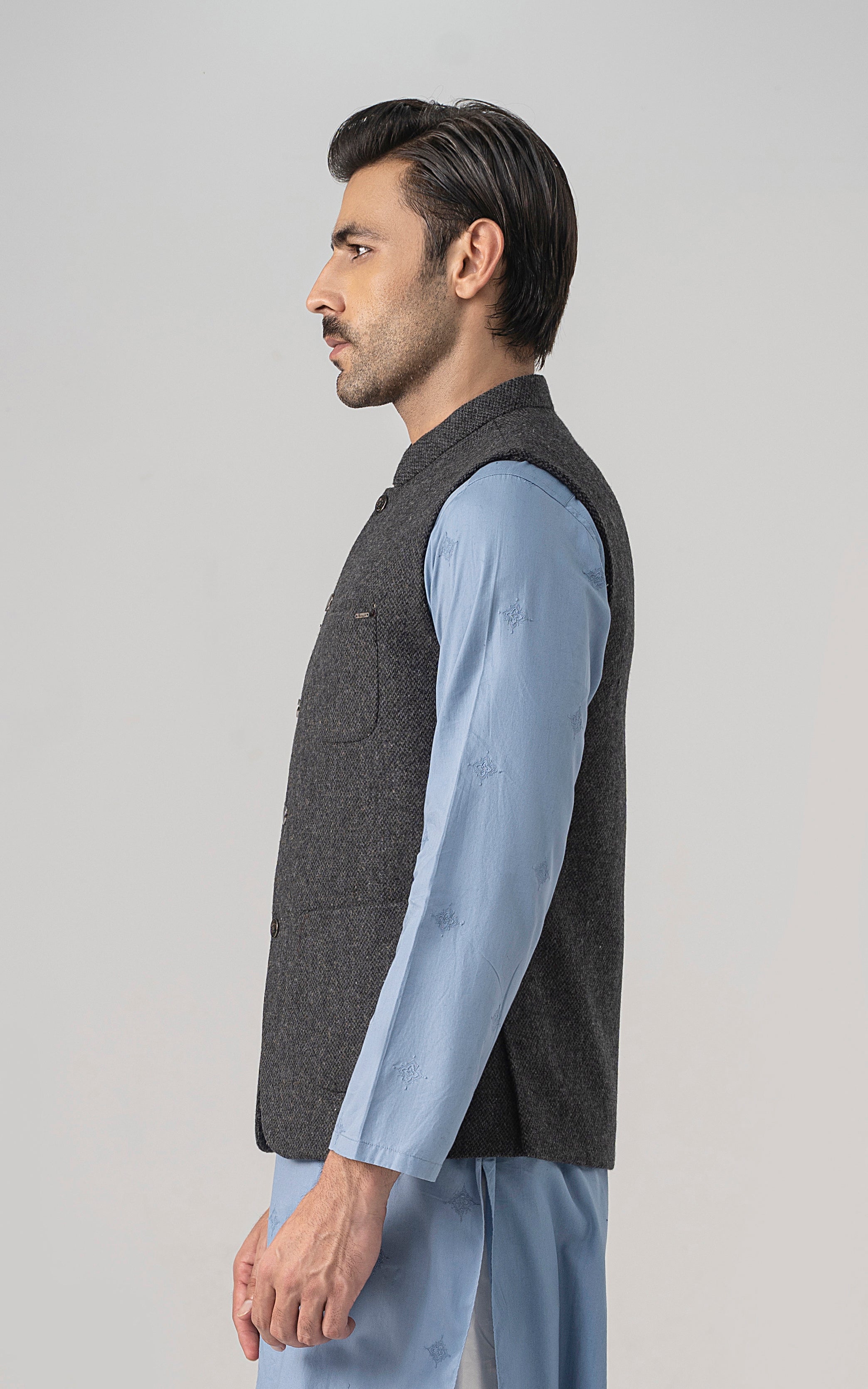 Grey textured wool-blend waistcoat, sleeveless, with button closure and patch pocket.