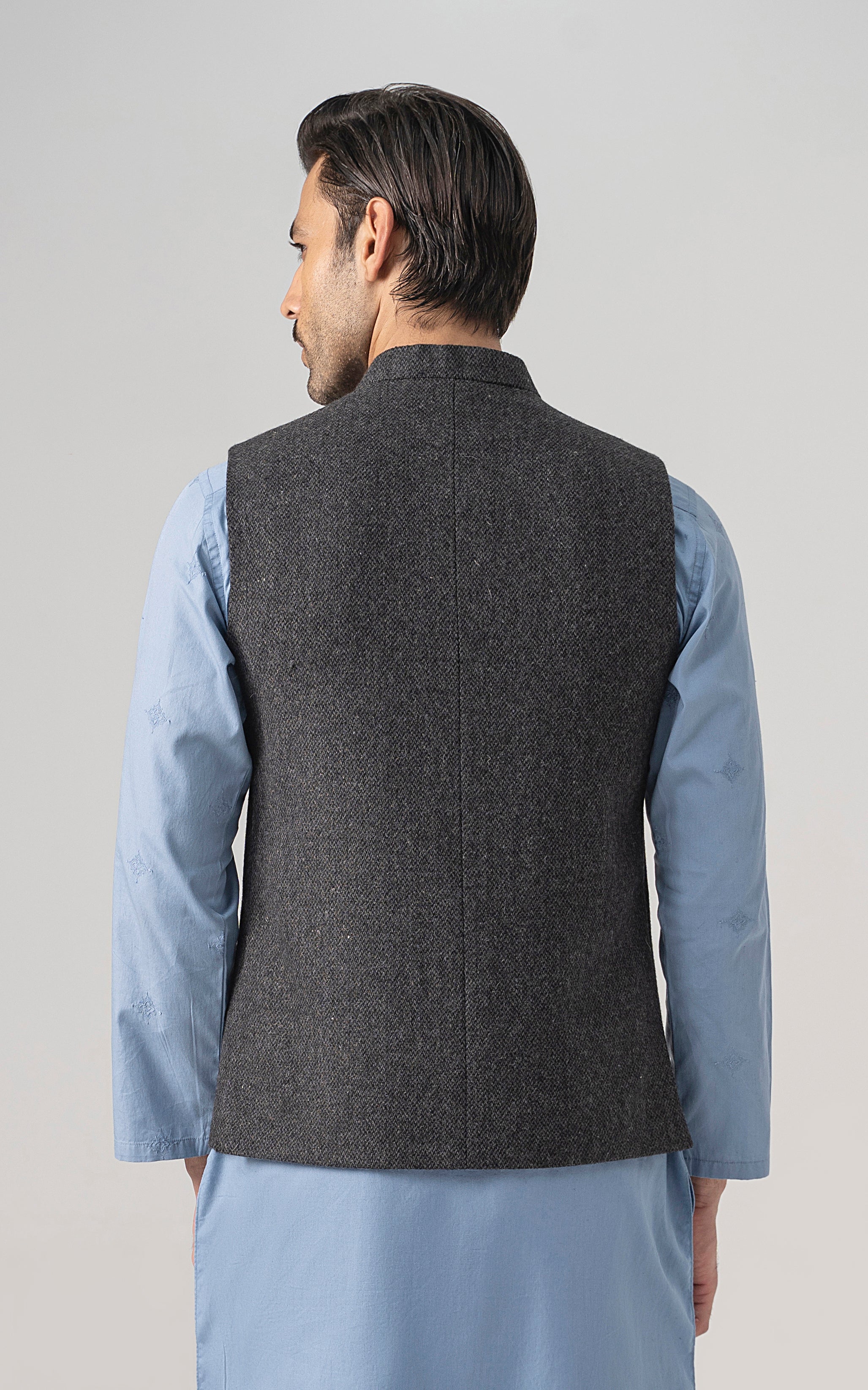 Grey textured wool-blend waistcoat back view with button placket and pocket.
