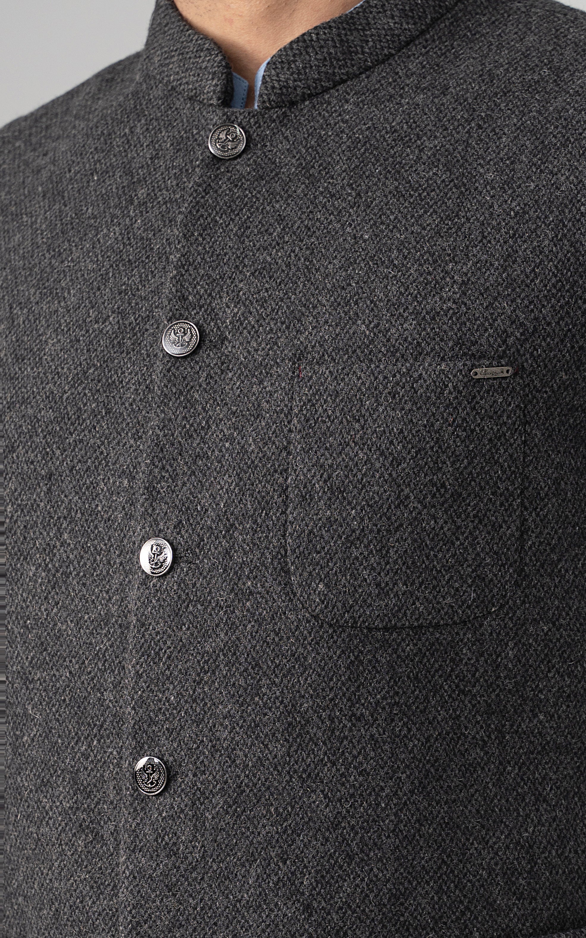 Grey textured wool-blend waistcoat with high collar and metal button detail.