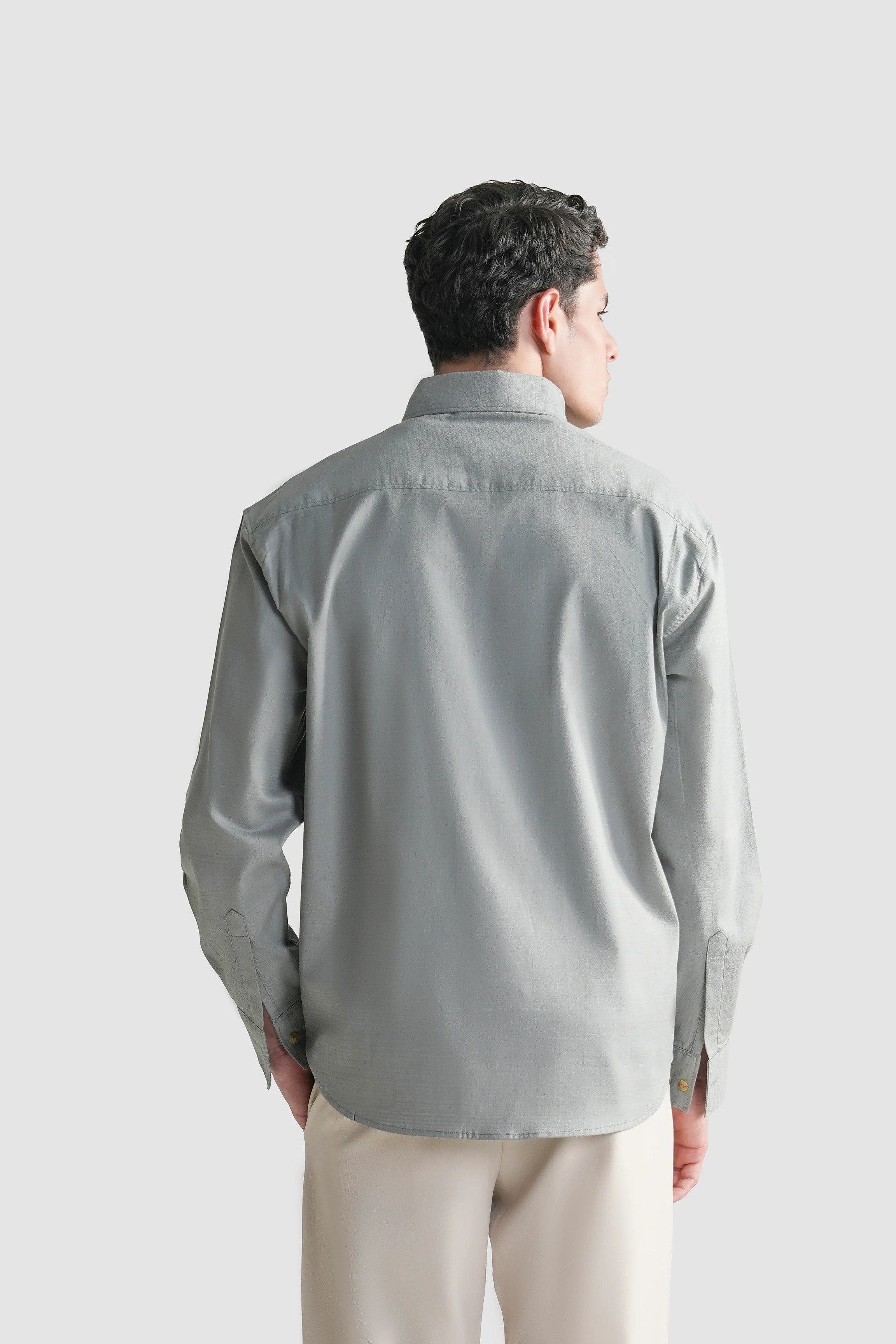 Grey button-down casual shirt shown from the back with long sleeves.