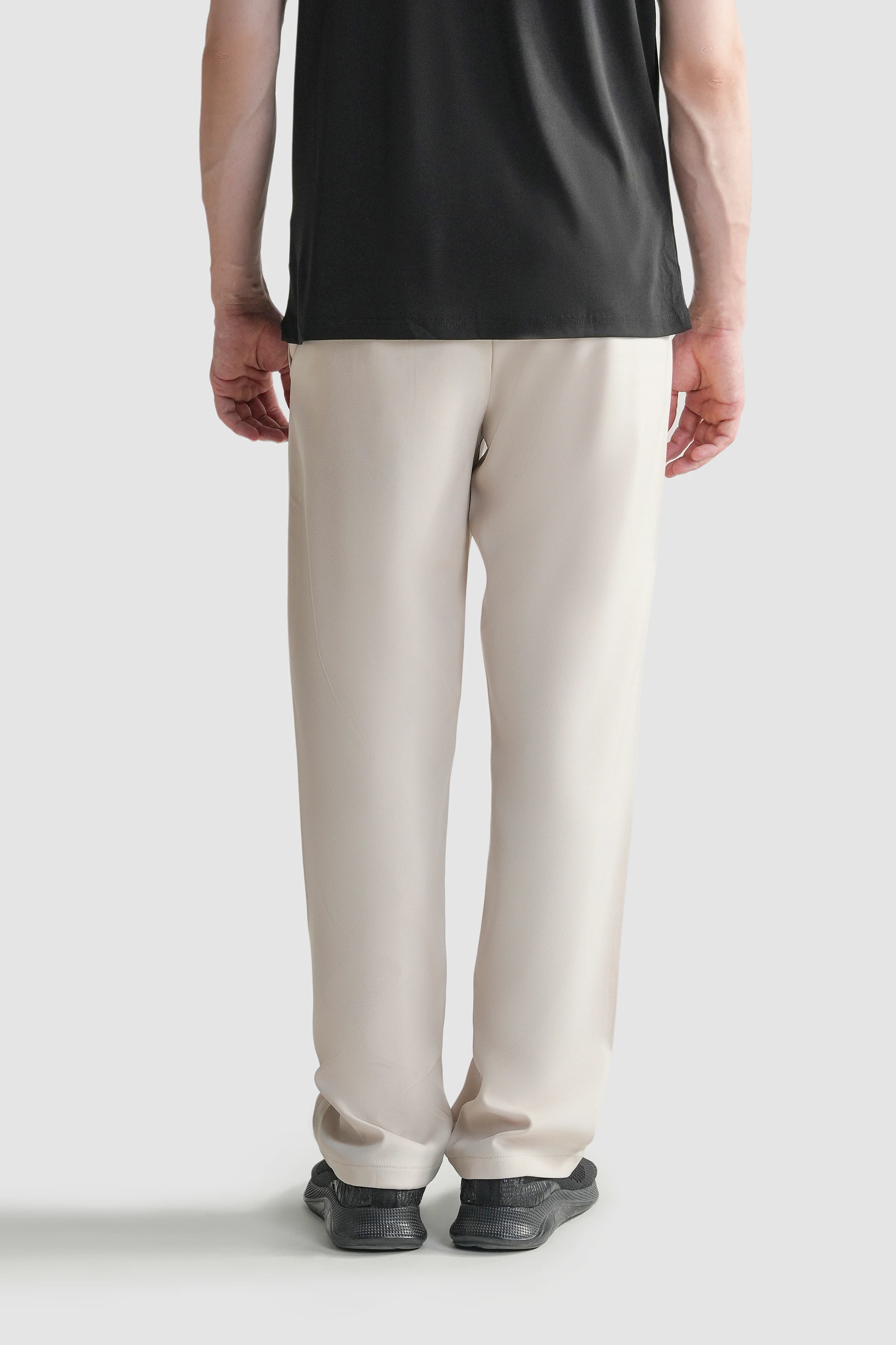 Beige straight-fit casual pants, back view with smooth seat and straight legs
