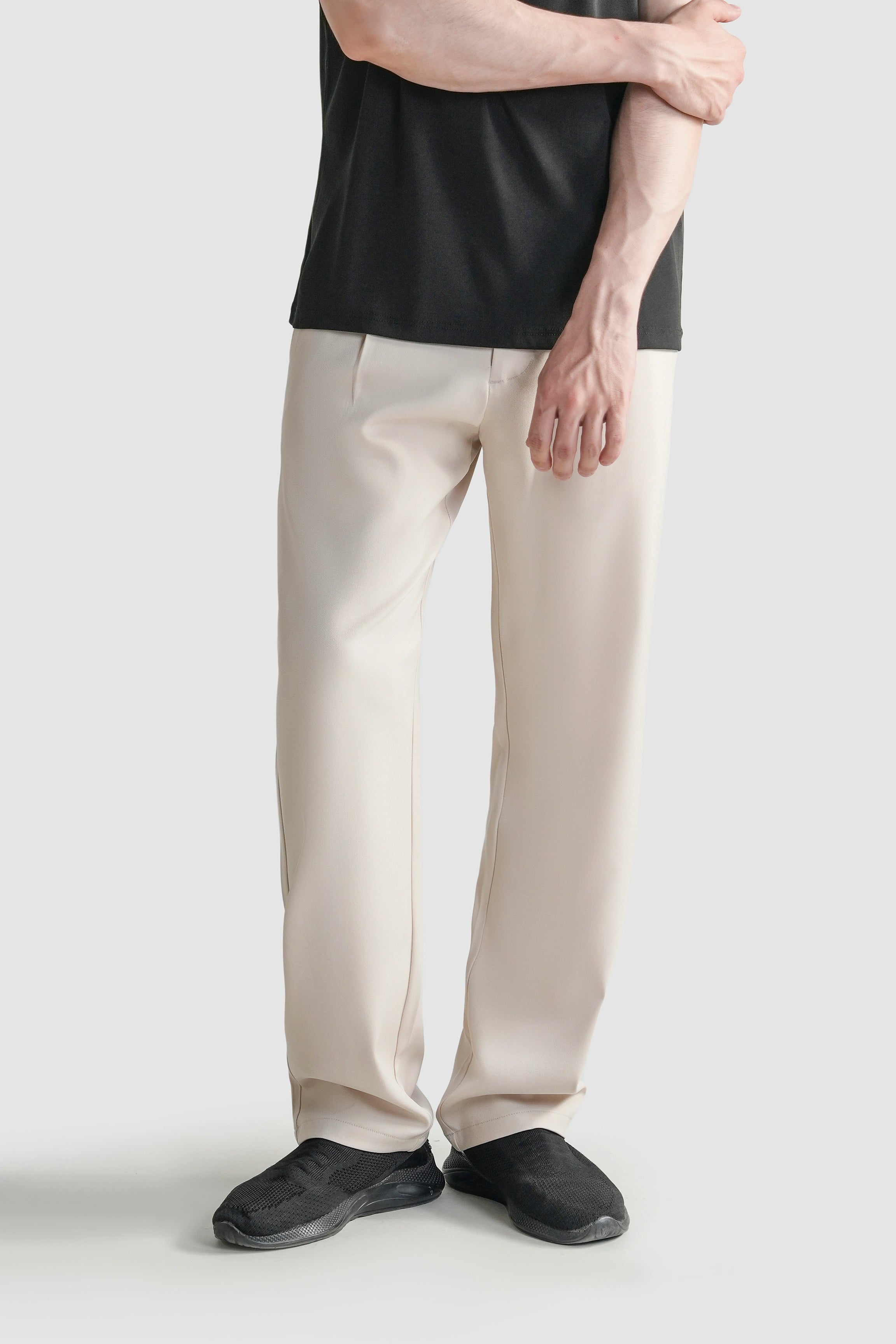 Beige straight-fit casual pants, front view with belt loops and side pockets