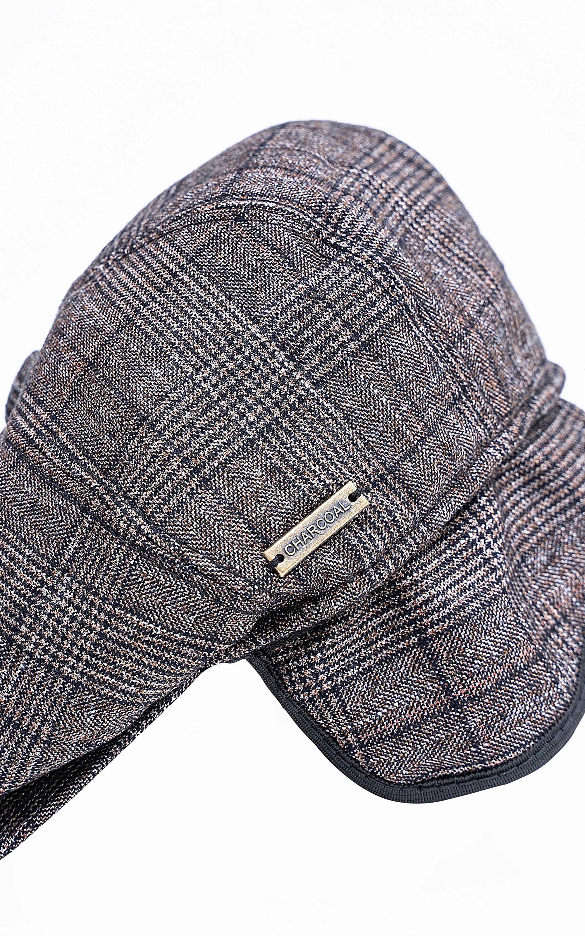 Gray plaid golf cap with fold-over ear flap and brand patch on front