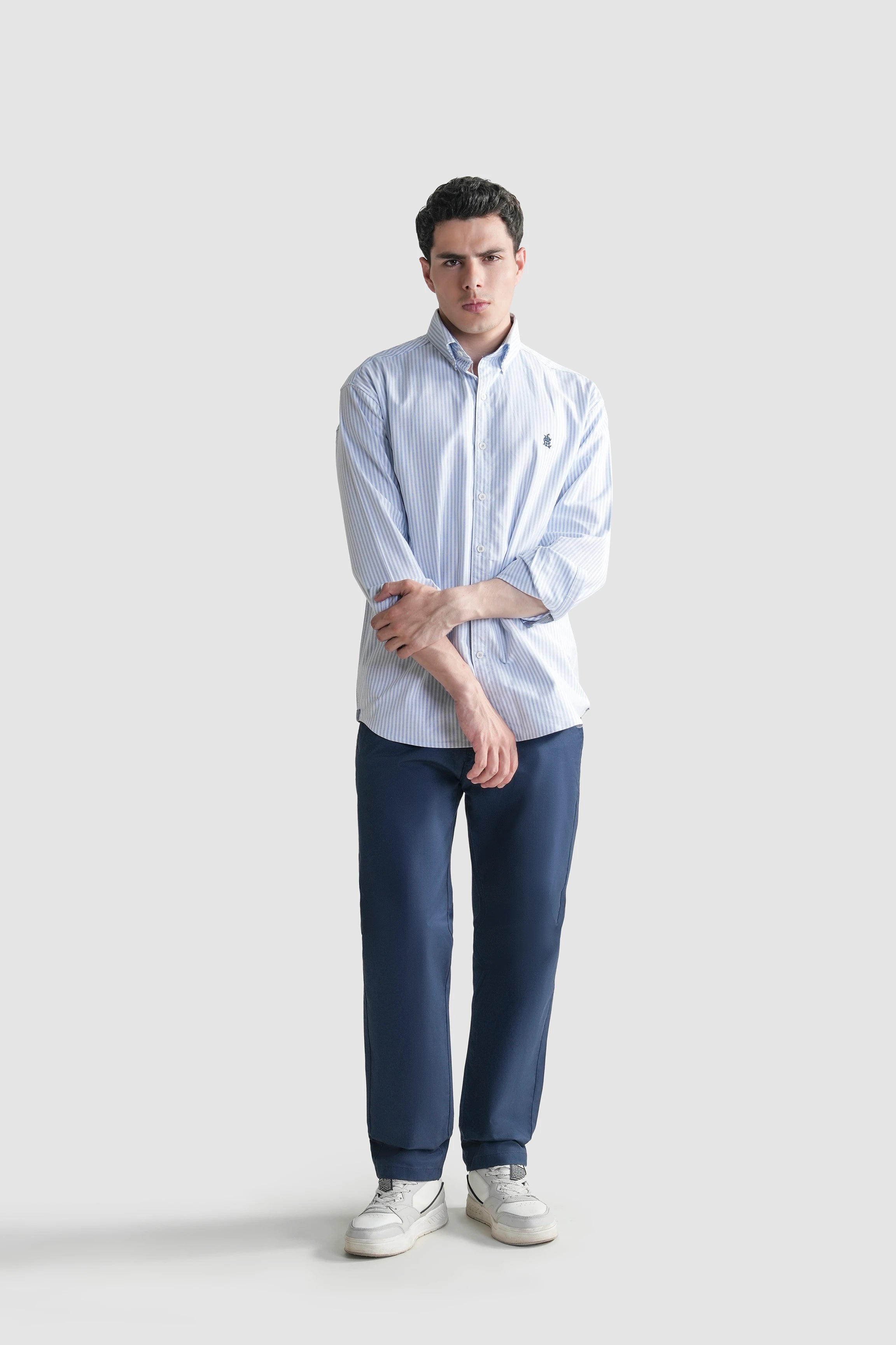 Men's light blue striped button-down casual shirt with front button placket