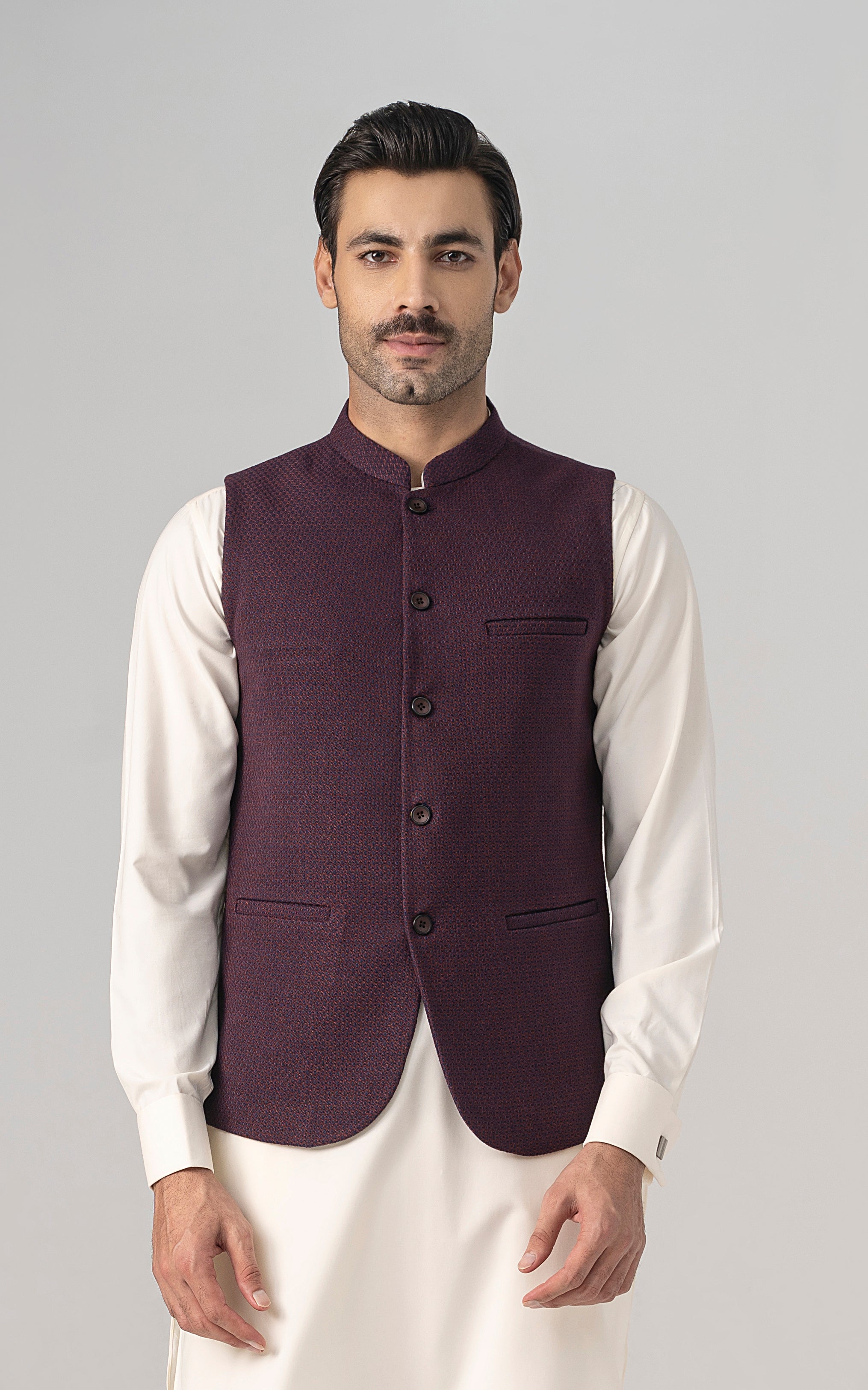 Maroon textured wool-blend waistcoat with four buttons and flap chest pocket