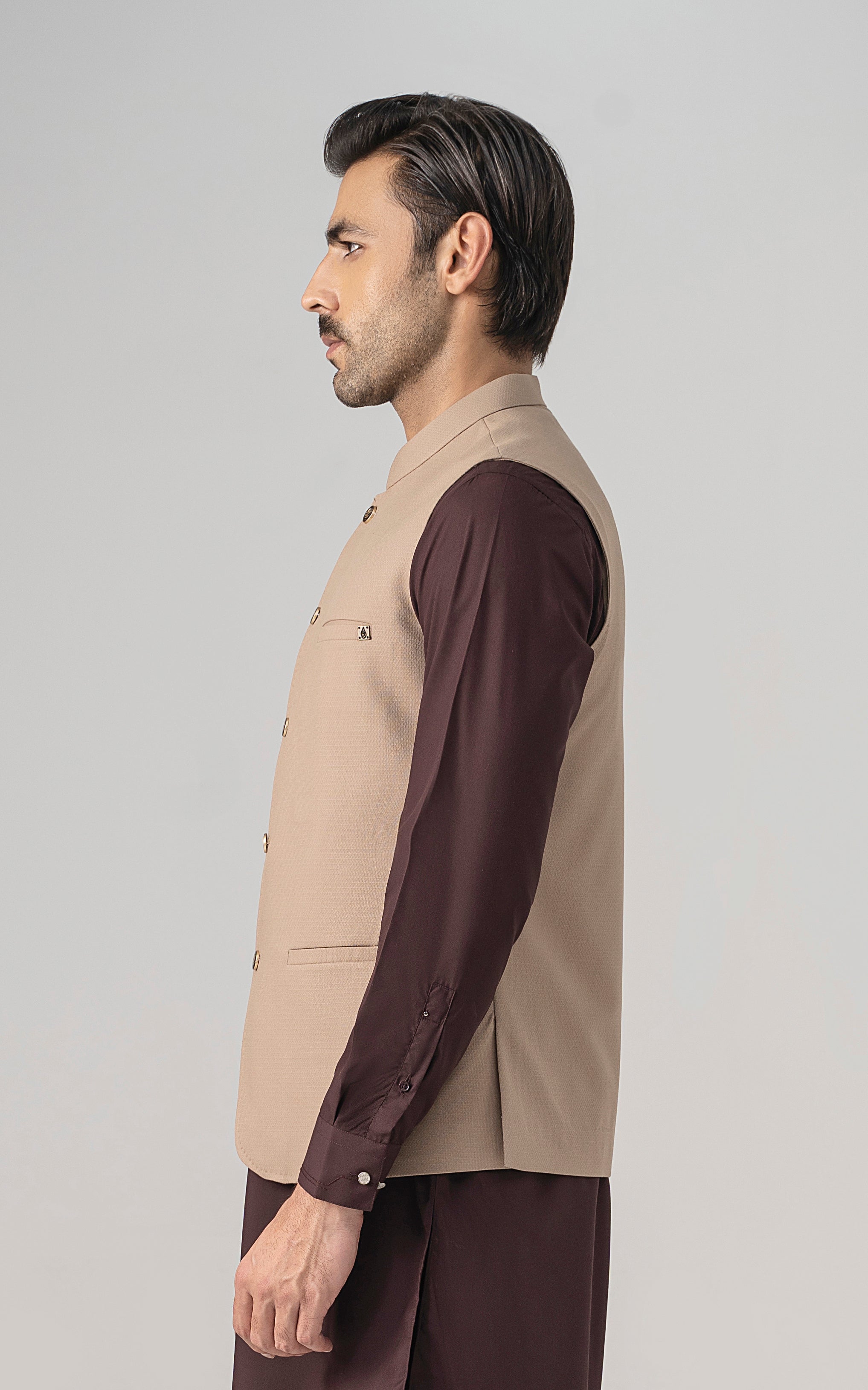 Khaki textured waistcoat, sleeveless with button front and side profile