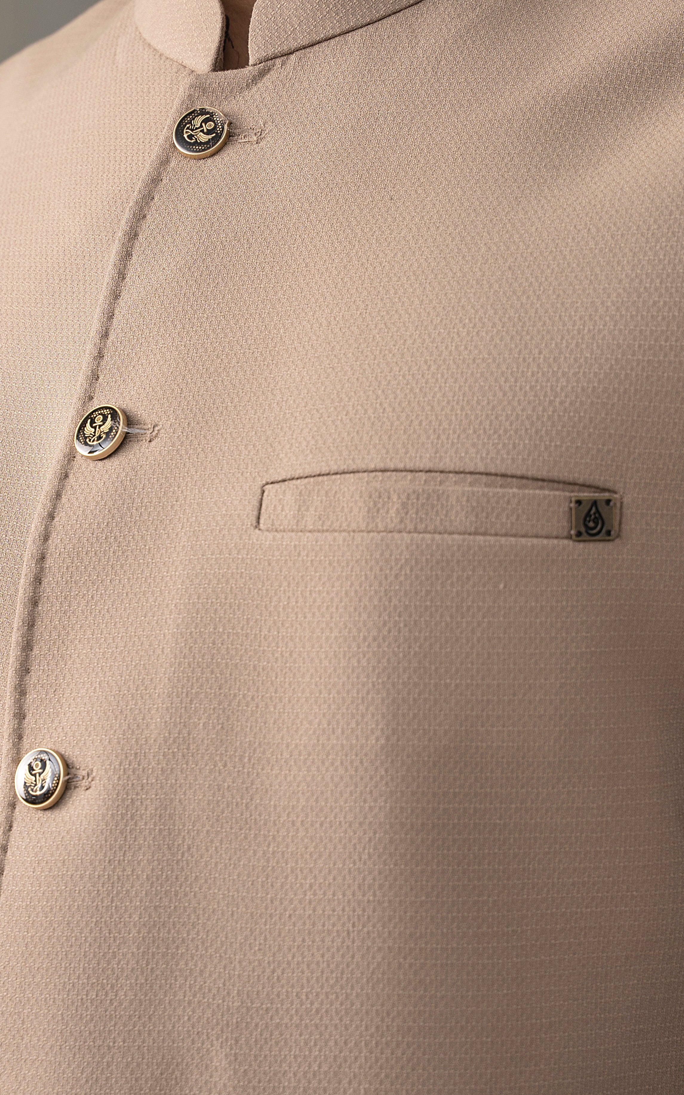 Khaki textured waistcoat close-up of buttons and chest label tab