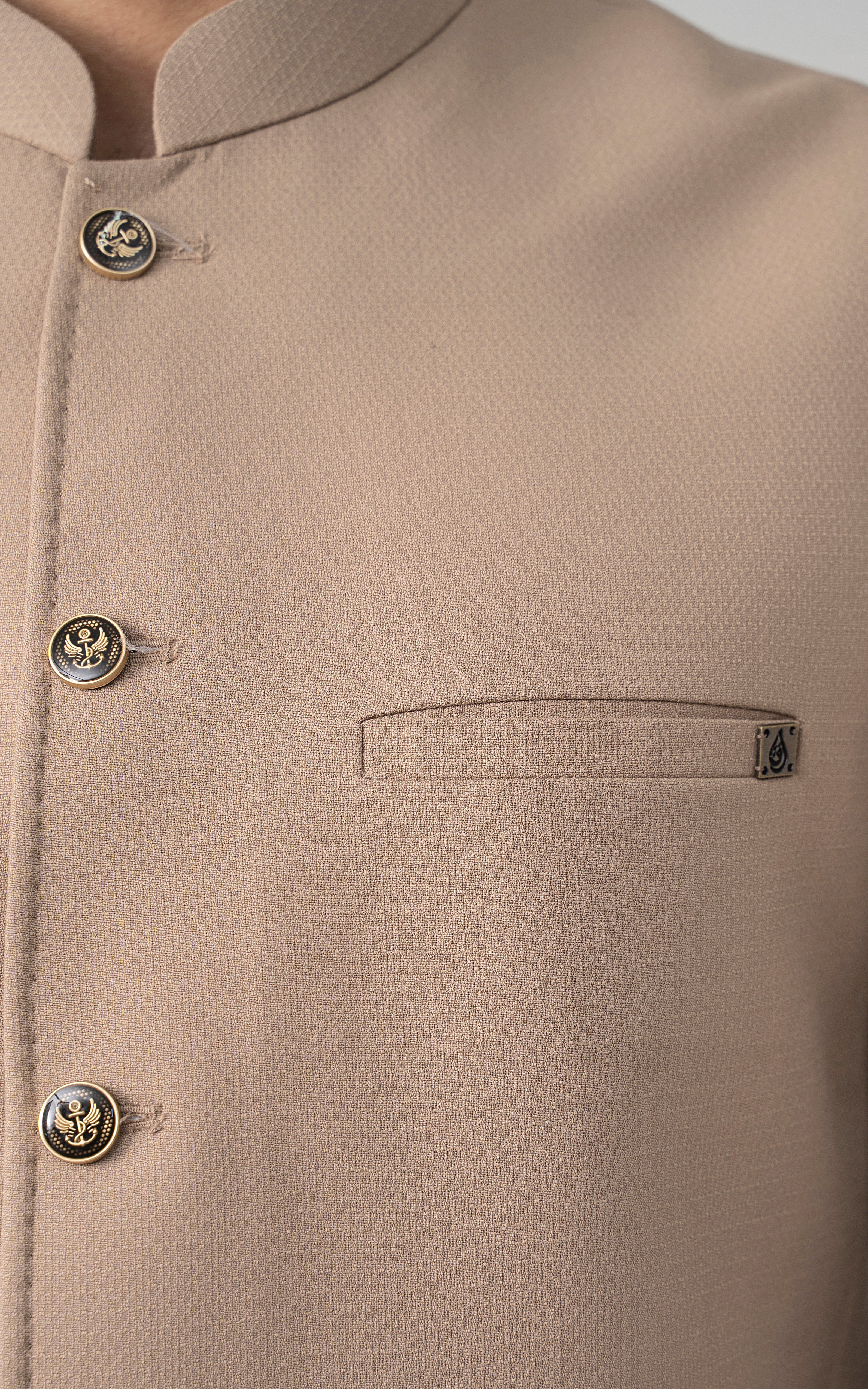 Khaki textured waistcoat chest pocket detail with gold buttons