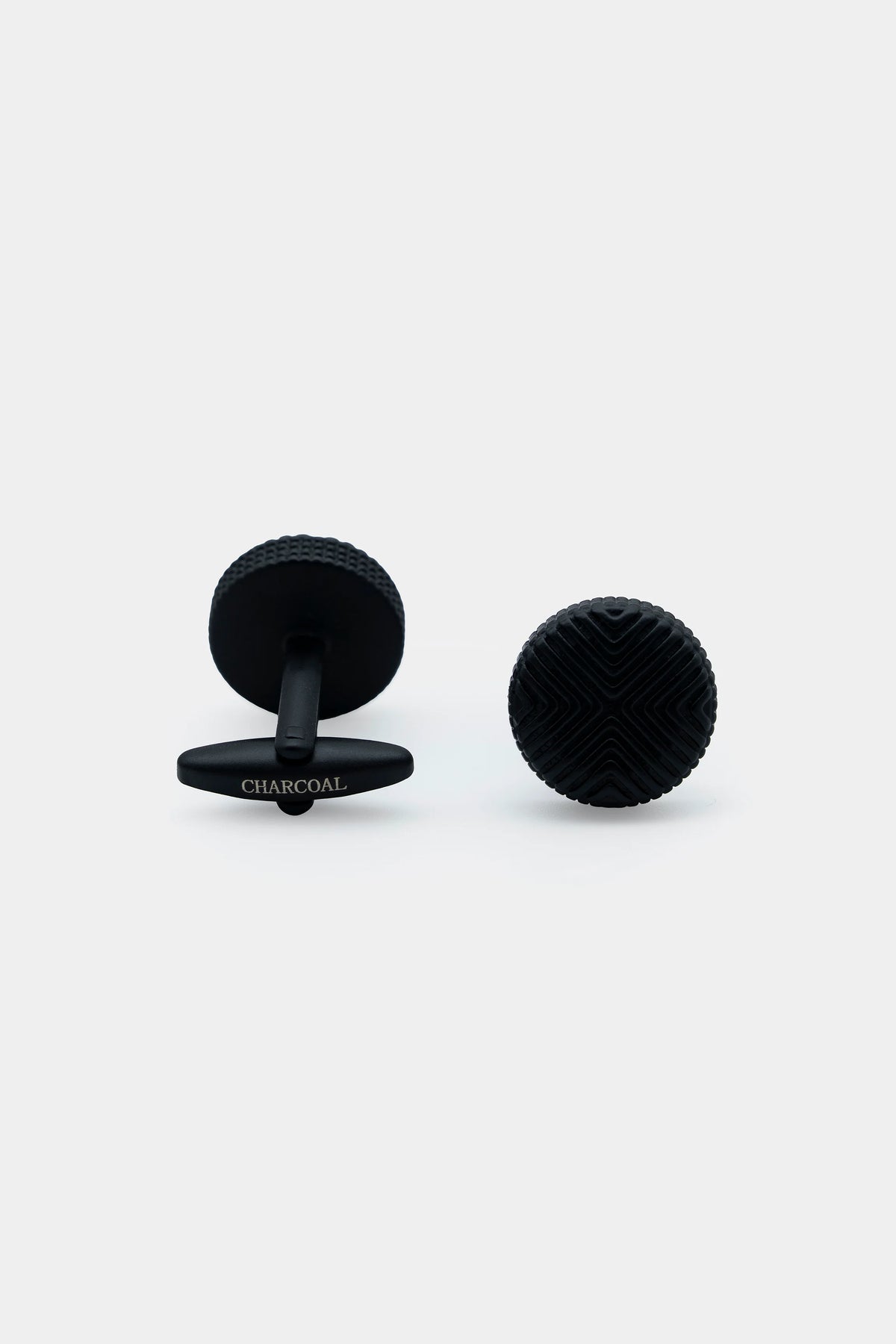 Charcoal cufflinks with textured circular face and black backing posts