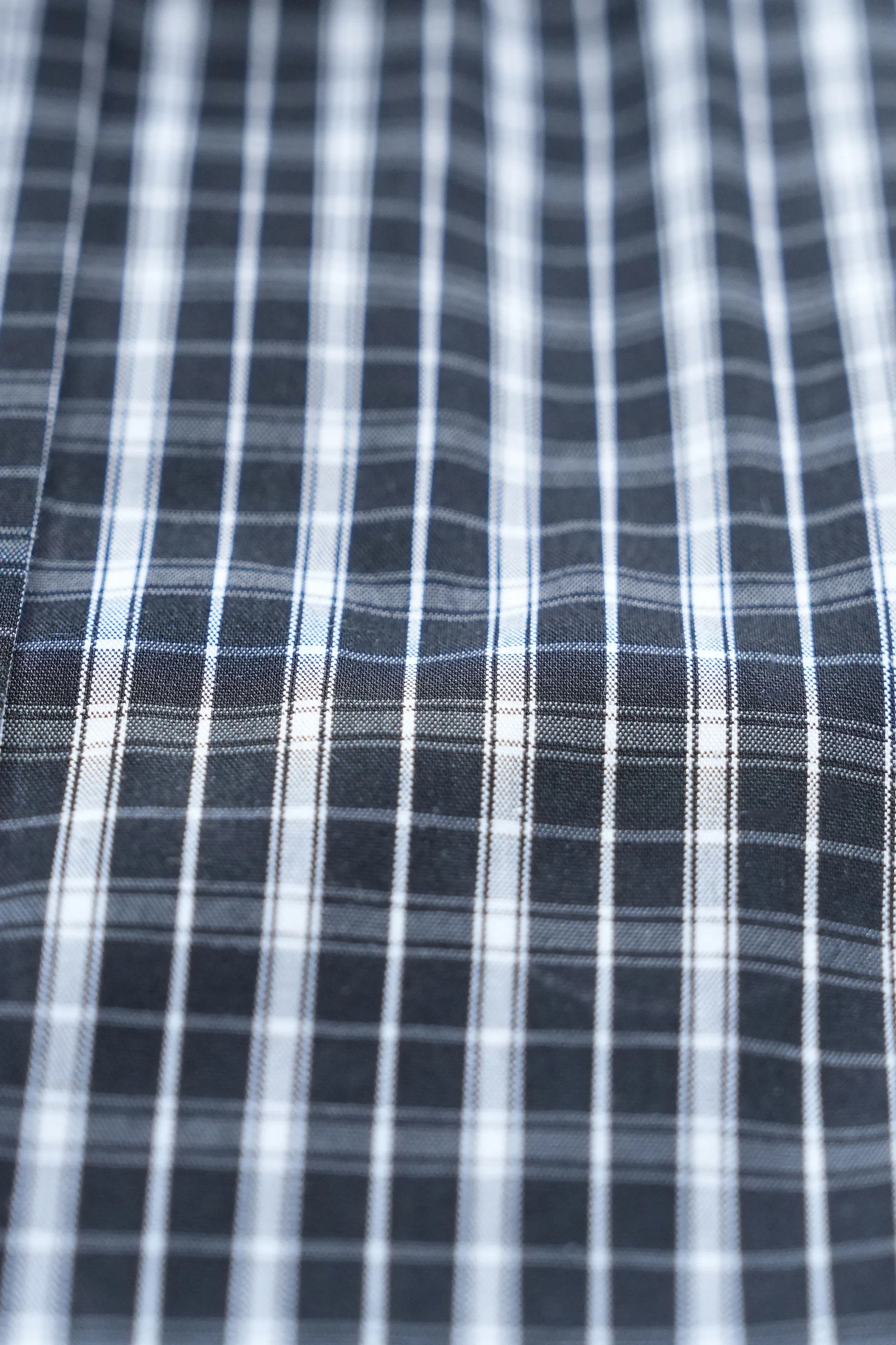 Black and white check dress shirt fabric with fine plaid lines