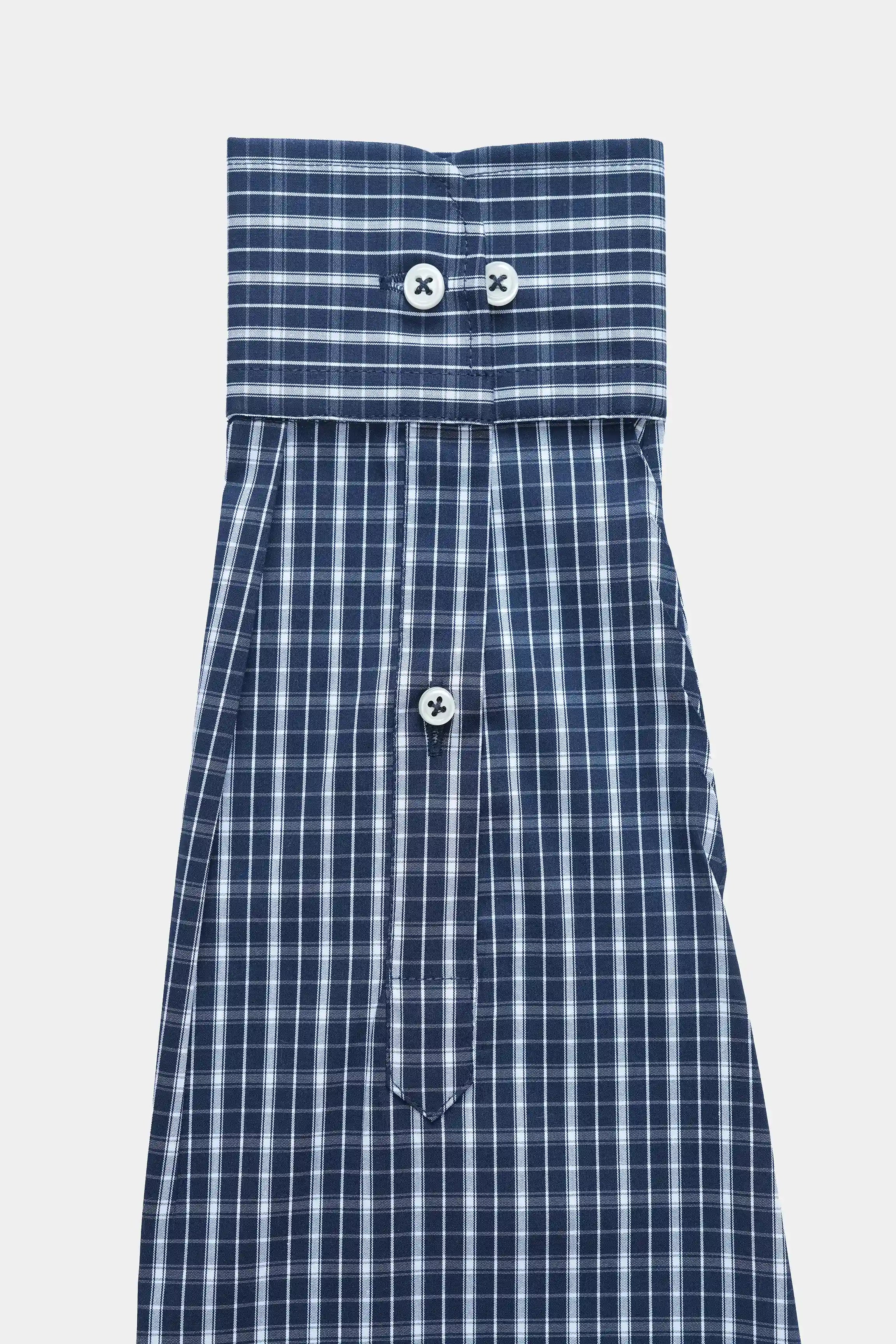 Navy check dress shirt front with two top buttons and long sleeves
