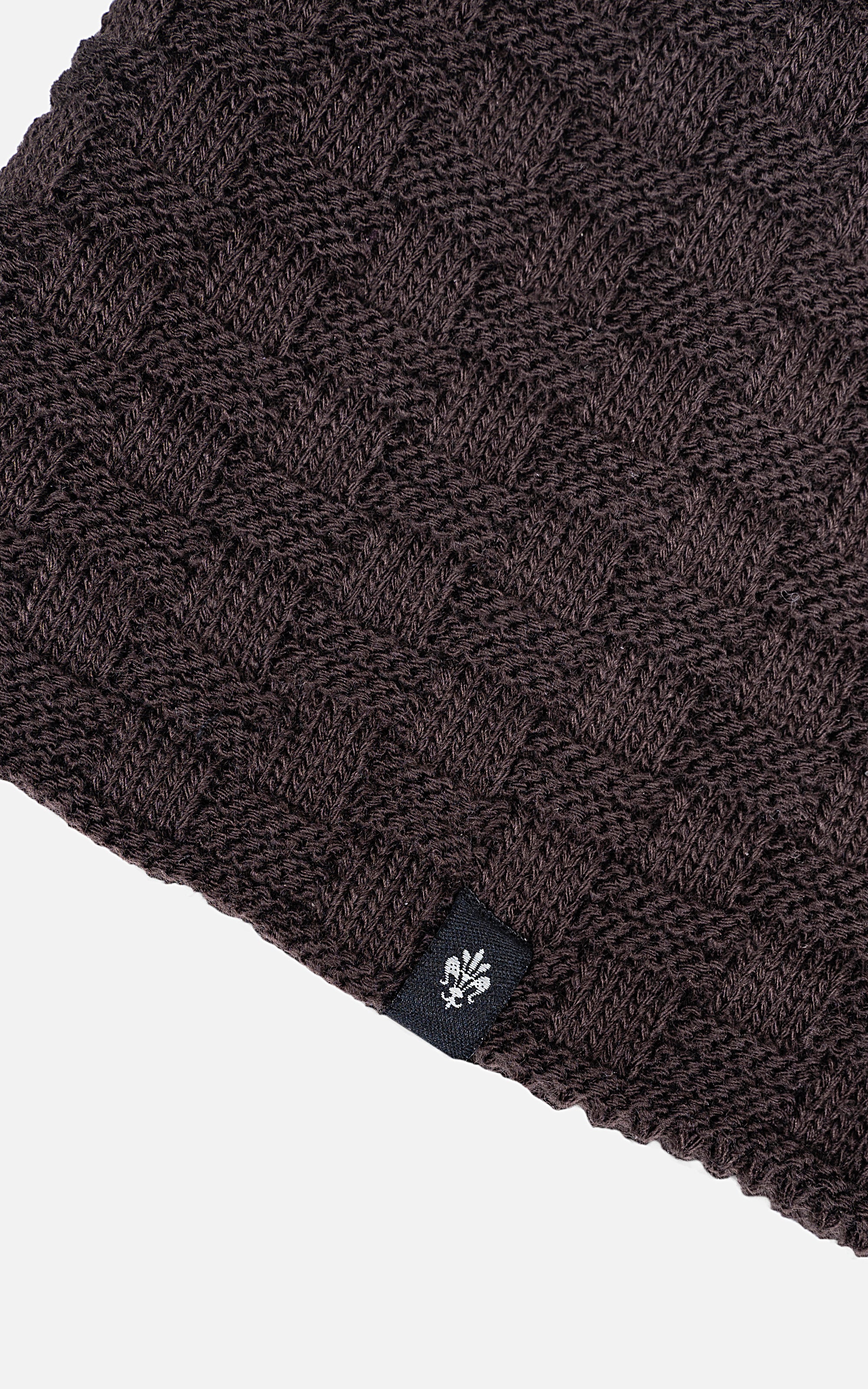 Dark brown knit beanie cuff with small logo patch at hem