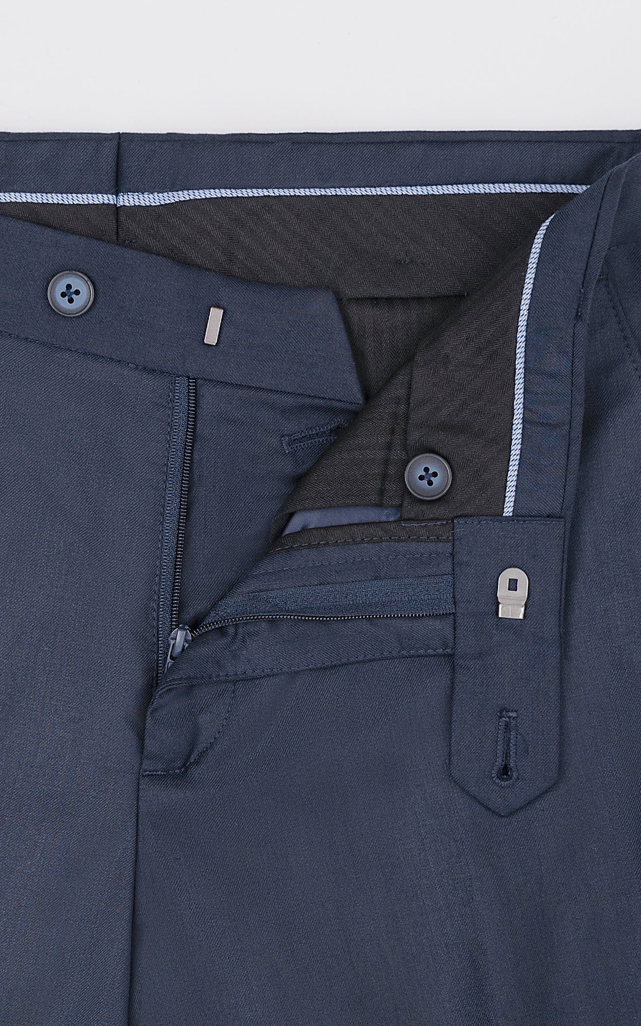 Navy dress pants front pocket with zipper and button details
