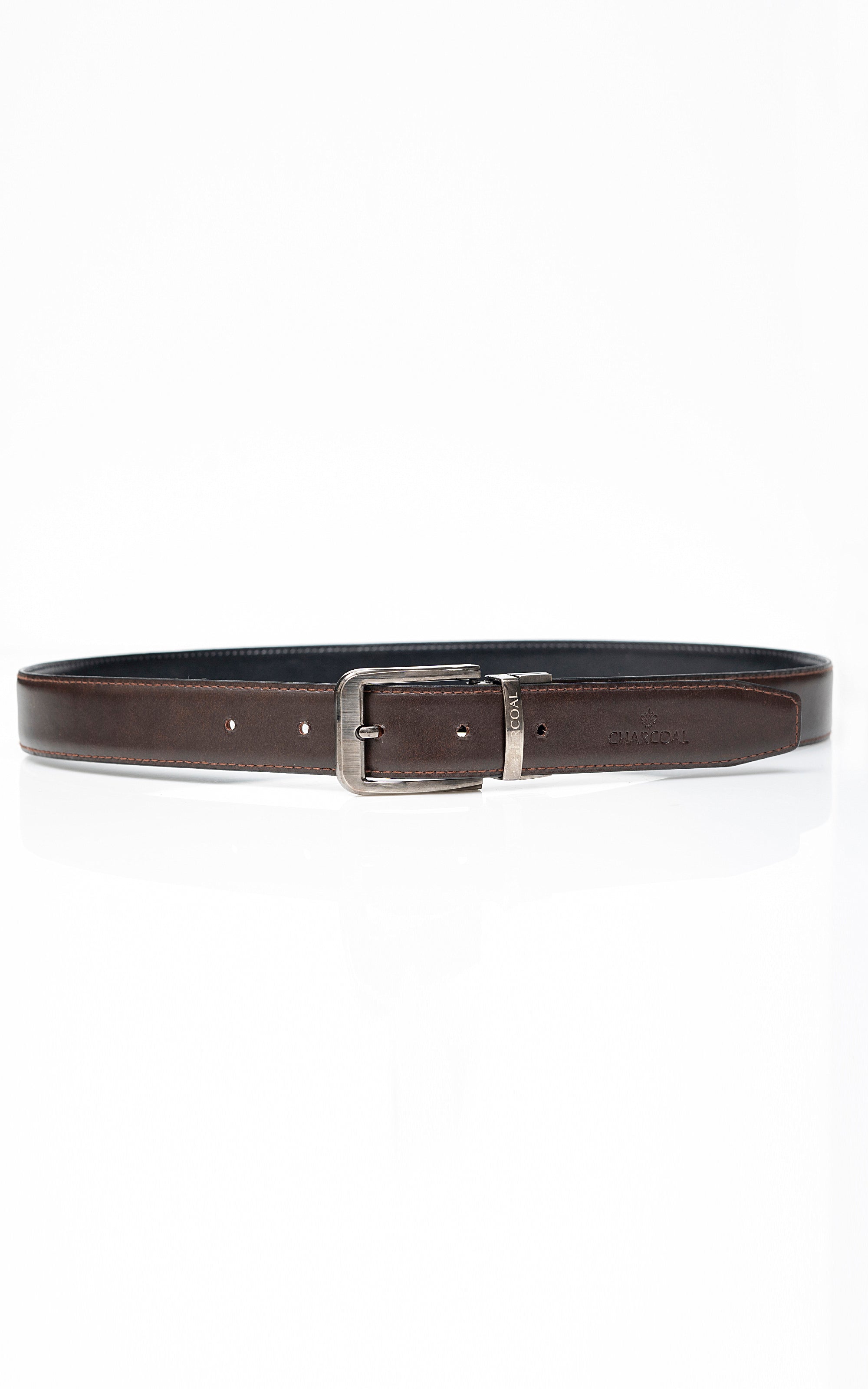 Reversible belt with dark outer leather, brown inner side, and silver square buckle.
