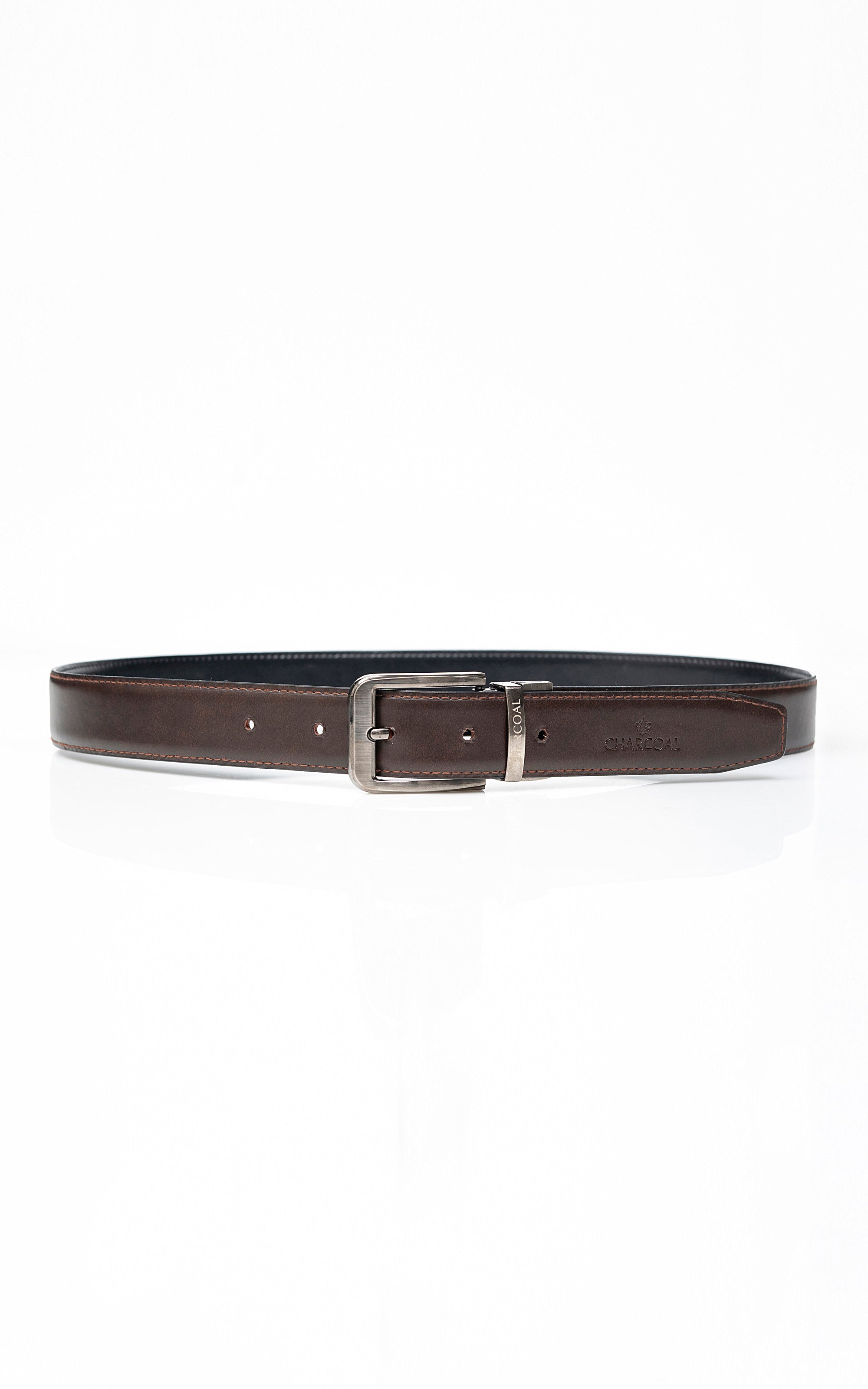 Reversible belt with dark outer leather, brown inner side, and silver buckle center bar.
