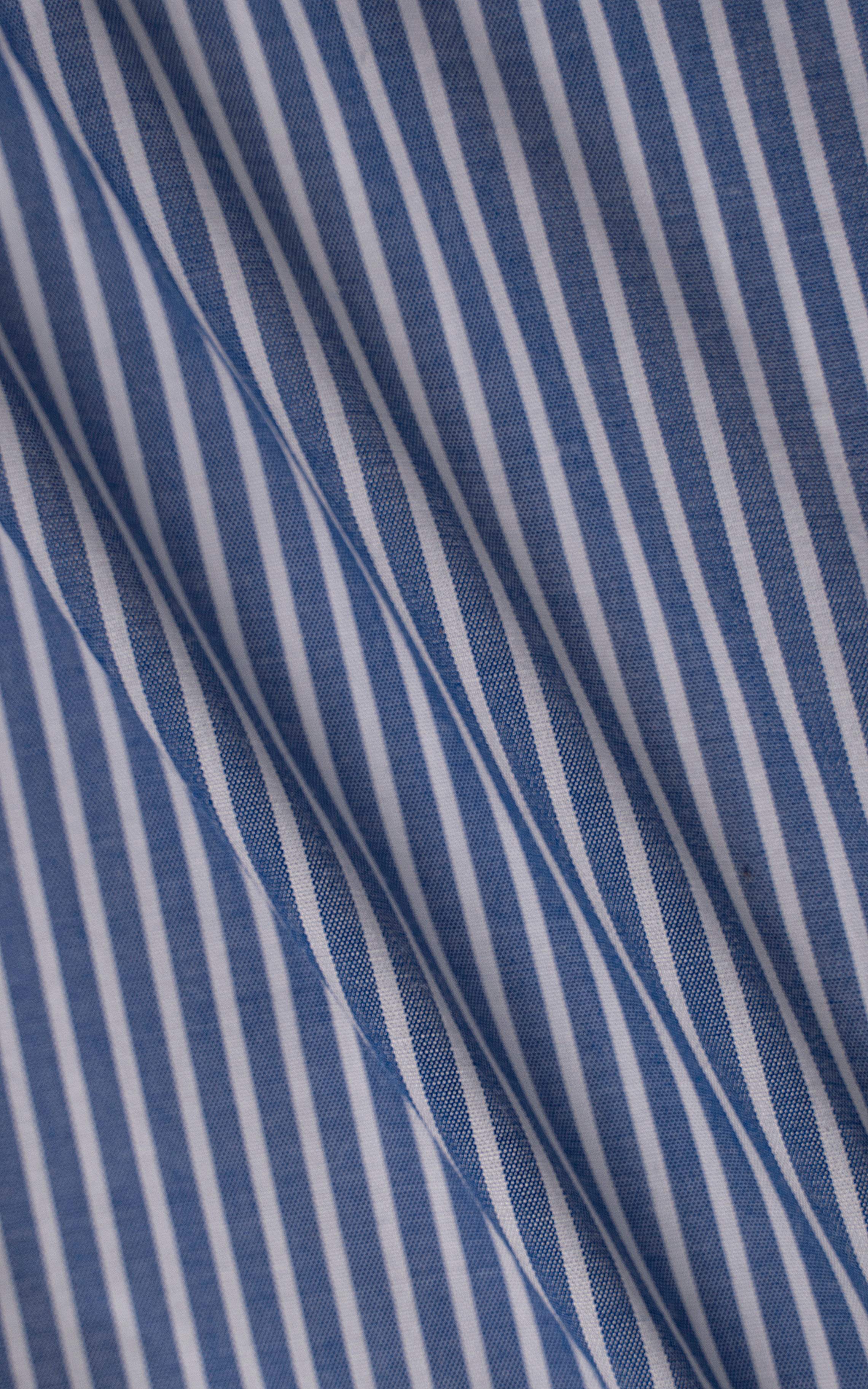 Blue and white striped shirt fabric texture, diagonal fold