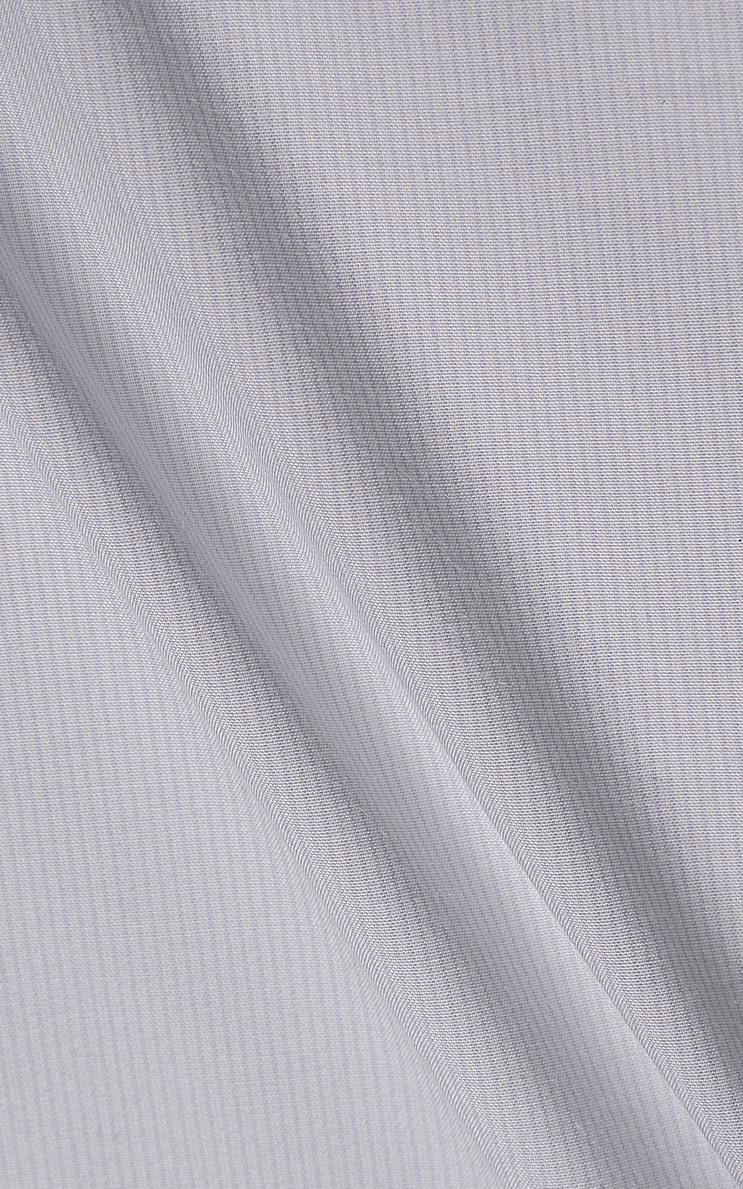 Light sky blue shirt fabric texture close-up.