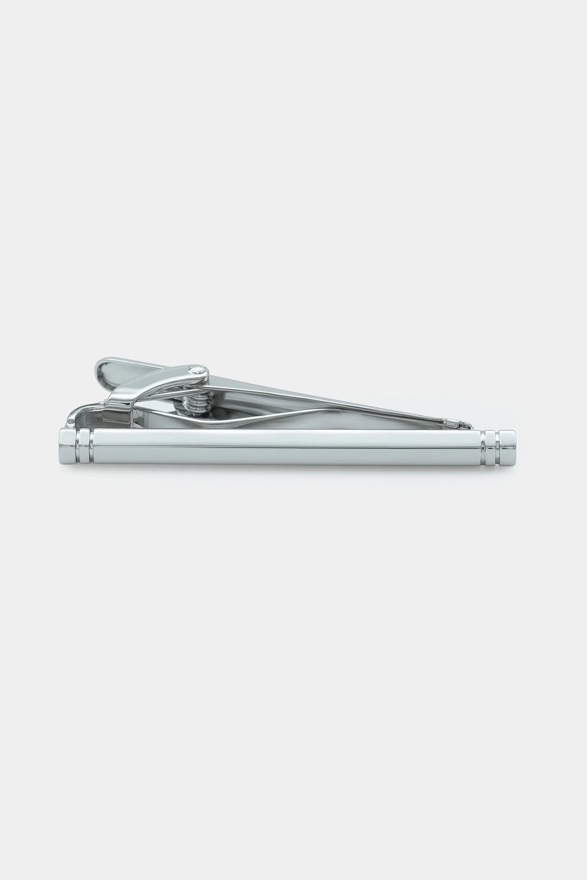 Polished silver tie pin with hinged clamp and long bar, side view
