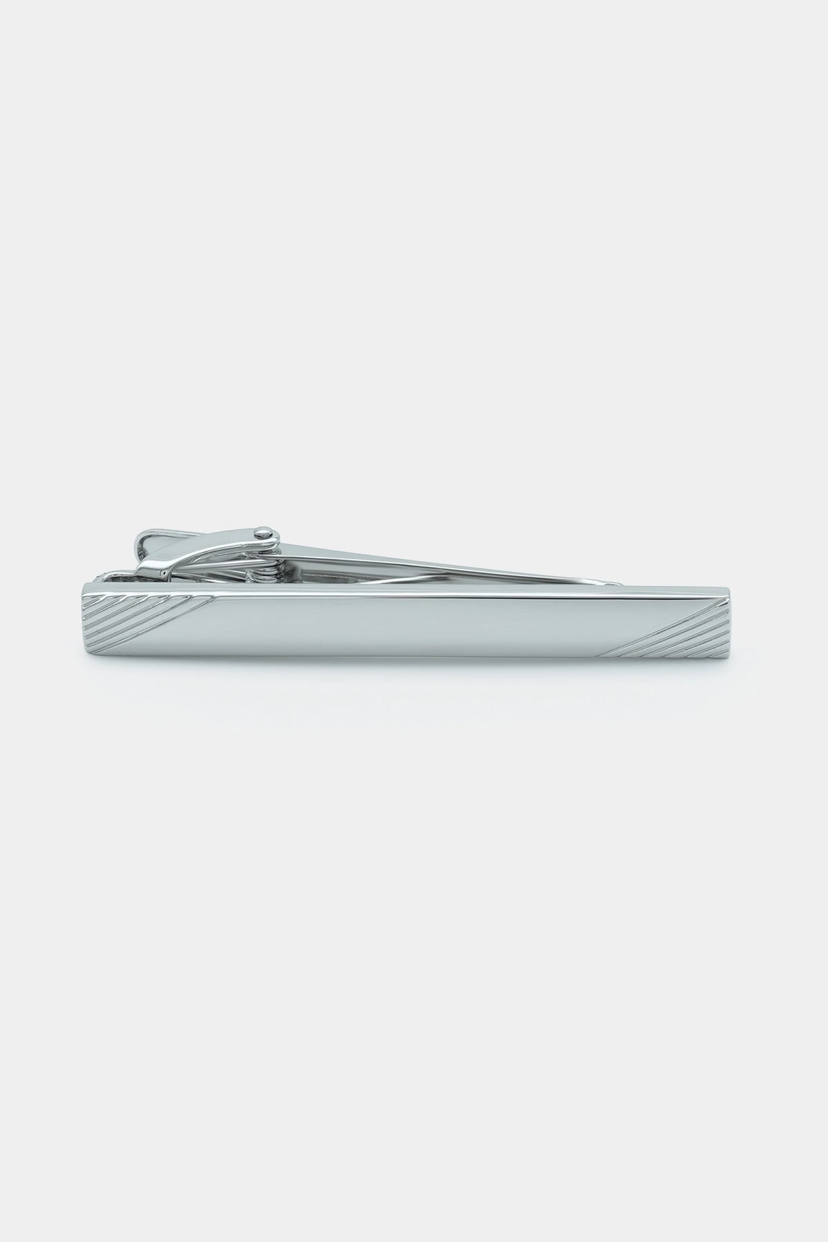 Silver tie pin bar with angled end and ridged texture