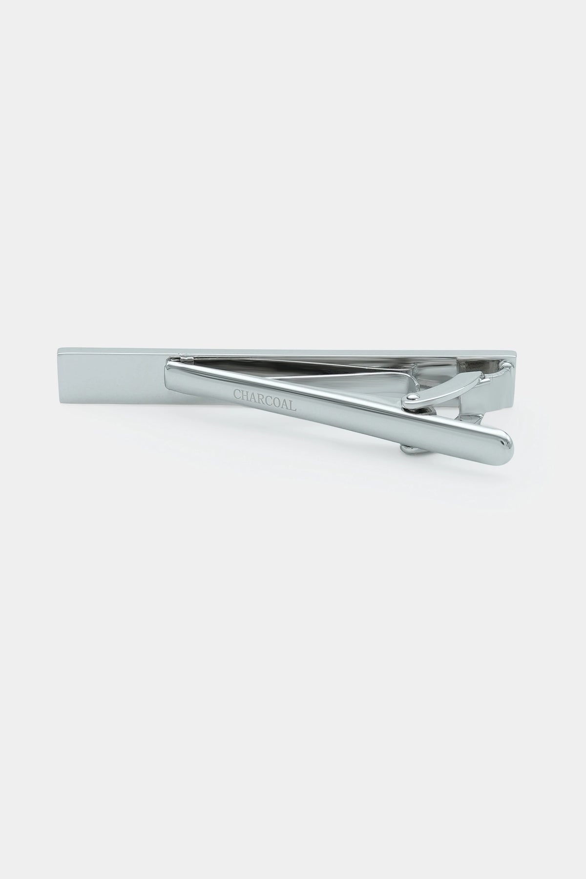 Silver tie pin with bar and spring hinge, side detail view
