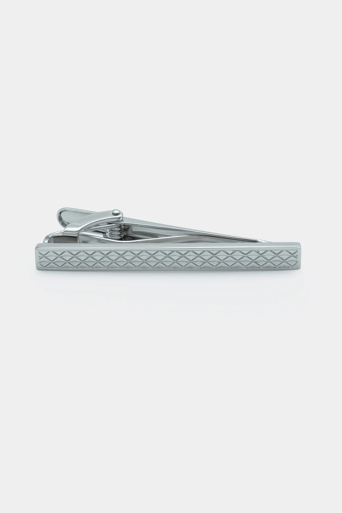 Silver tie bar pin with textured diamond pattern and hinged clamp