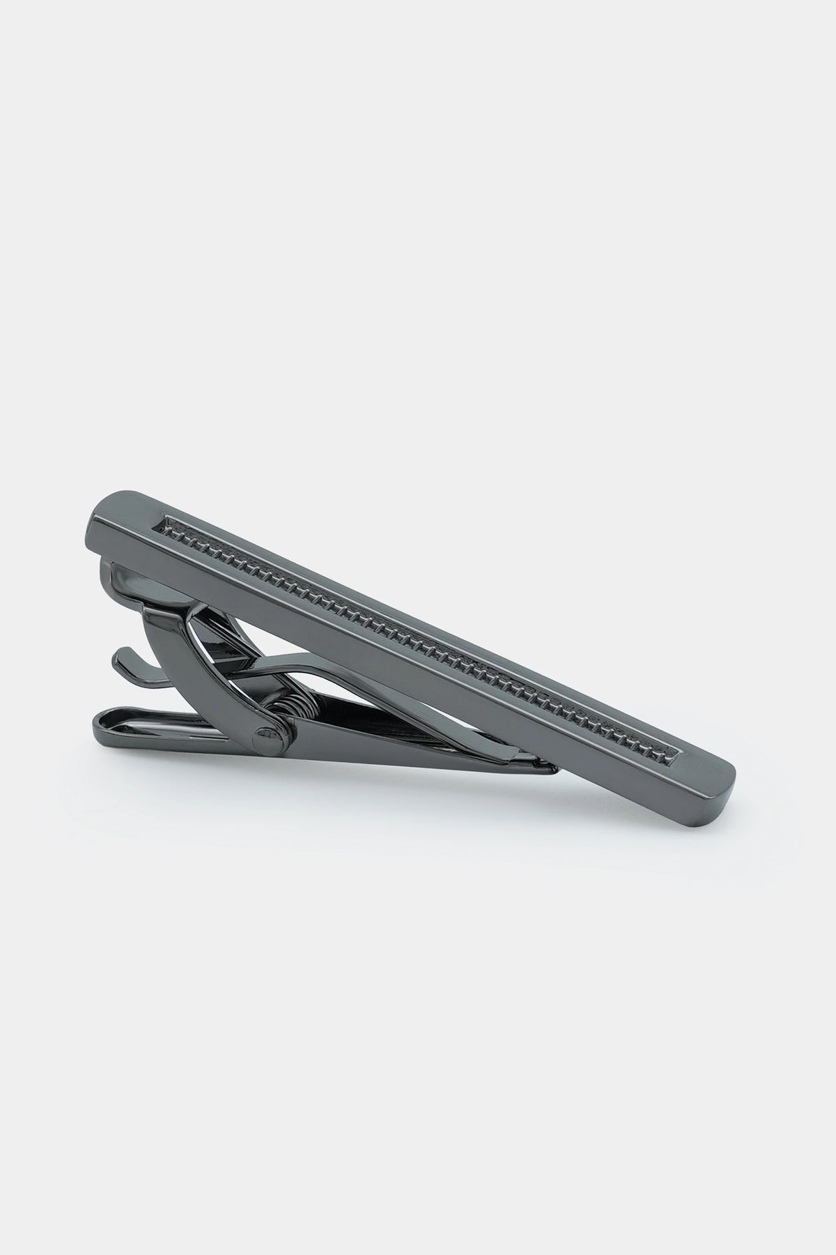 Gray tie pin with ridged bar and hinged clasp, metallic finish