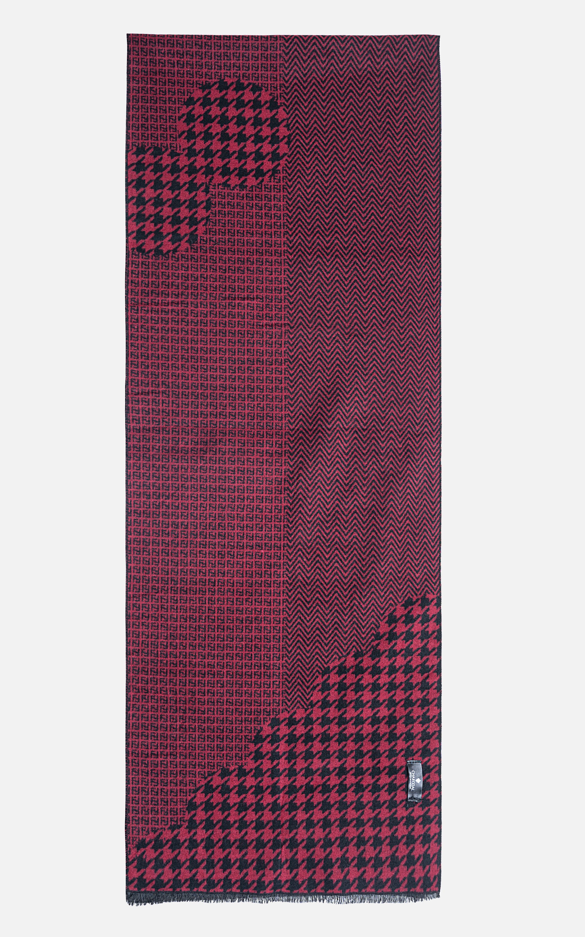 Burgundy scarf with black houndstooth panels and stitched border edges.