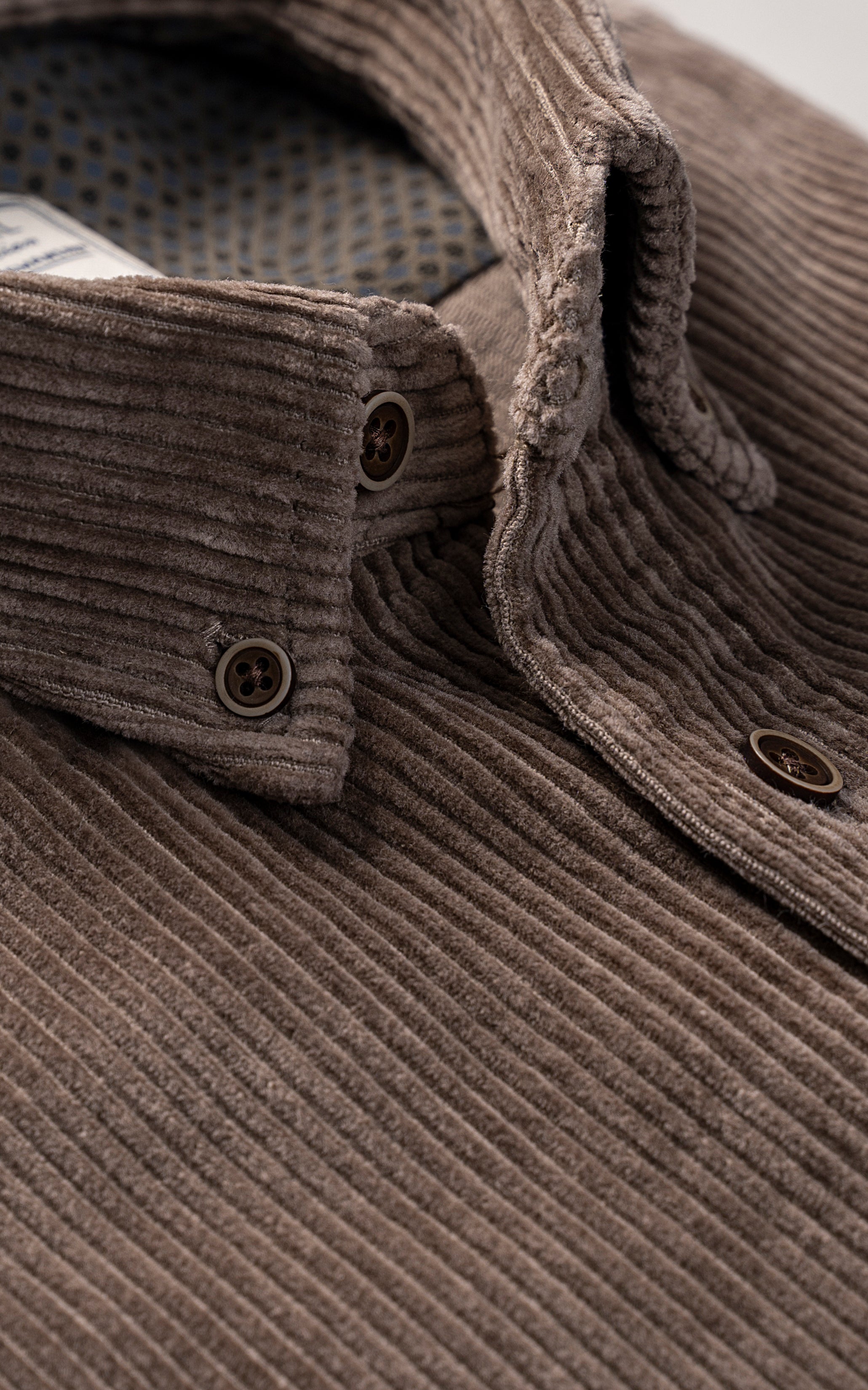 Khaki corduroy shirt neckline and front placket with two buttons