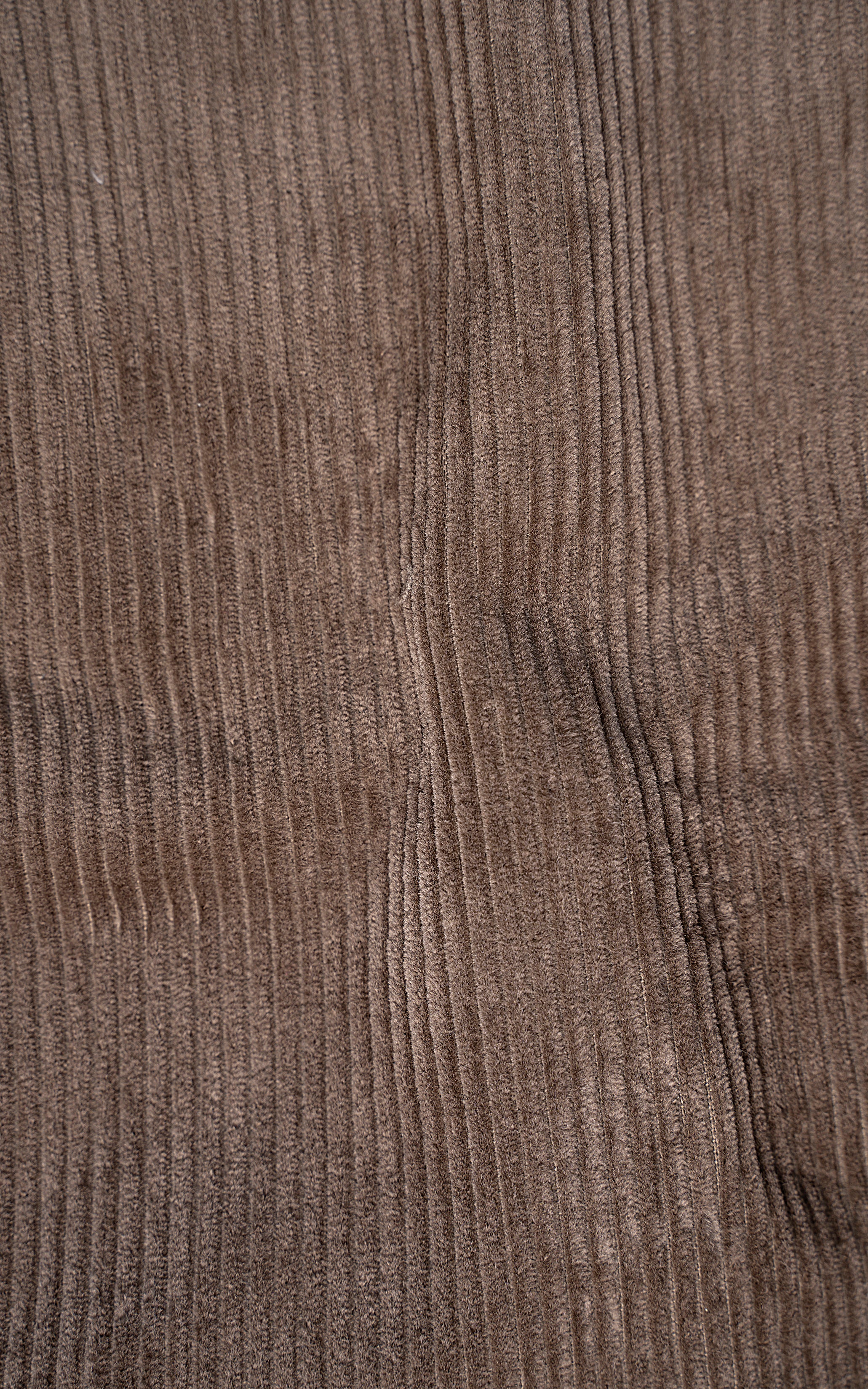 Khaki corduroy fabric panel with fine vertical ridges