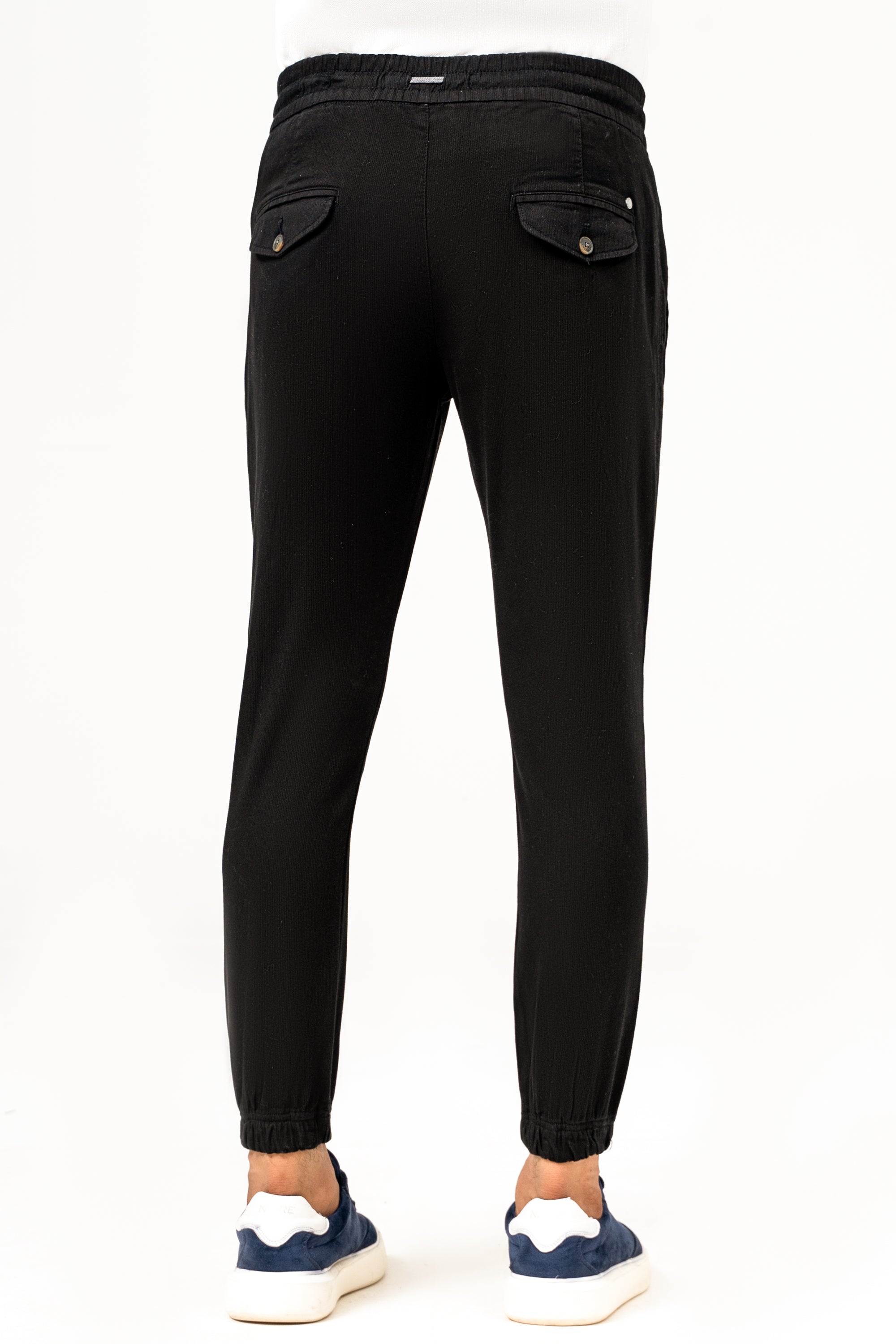 Black casual jogger trousers with rear patch pockets and tapered ankle cuffs