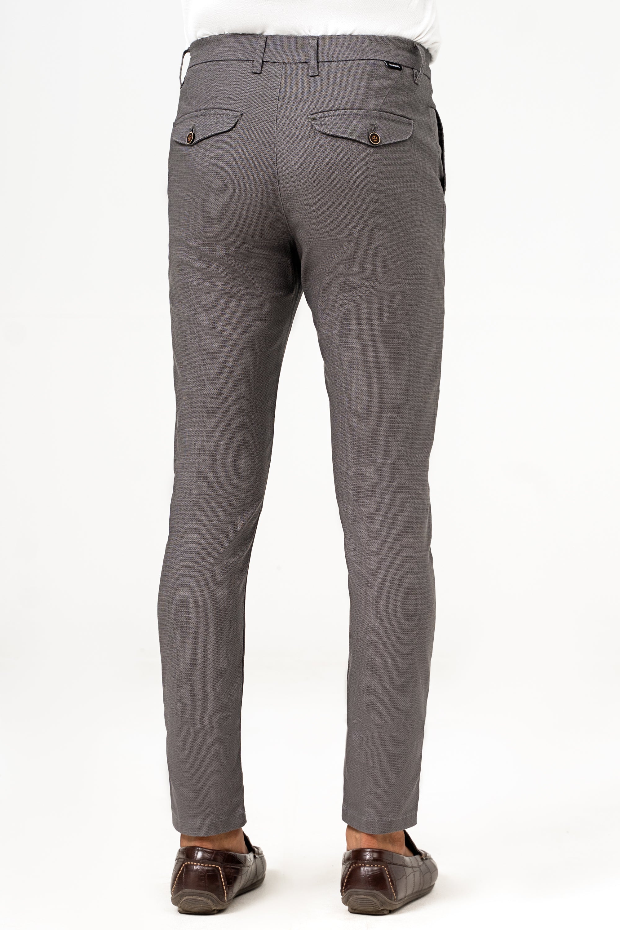 Dark grey trousers rear view with belt loops and buttoned back pockets