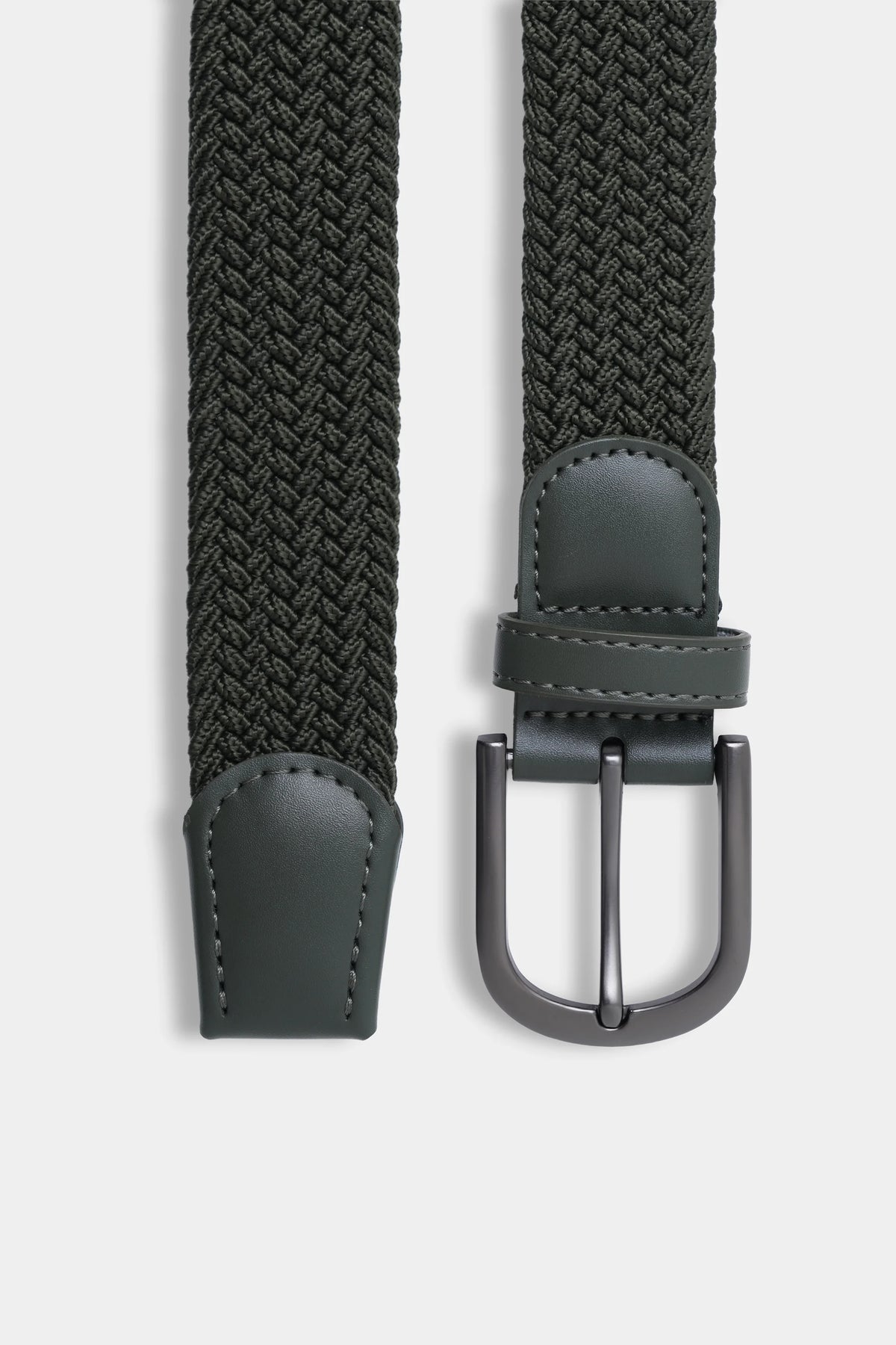 Close-up of dark woven belt with silver U-buckle and stitched leather keeper