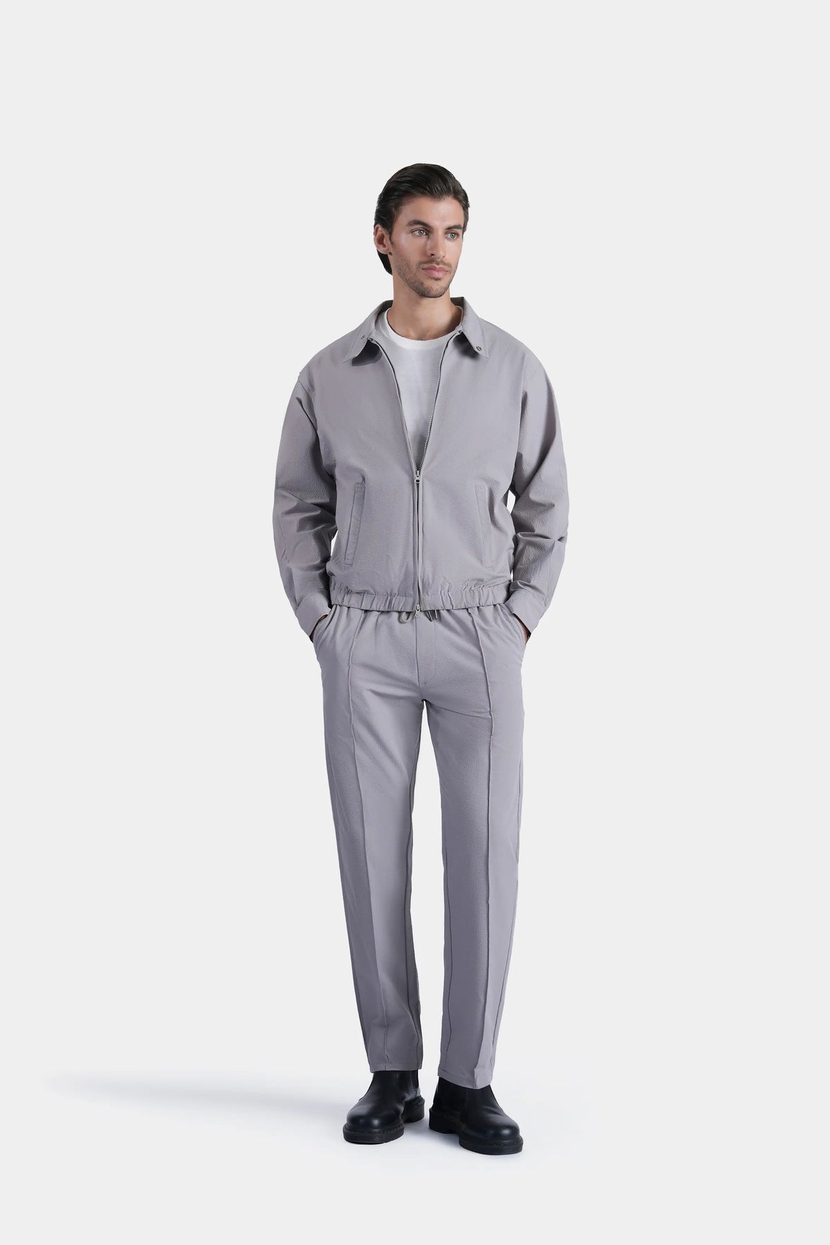 Light grey zip-up raglan jacket with stand collar, elastic cuffs and waistband