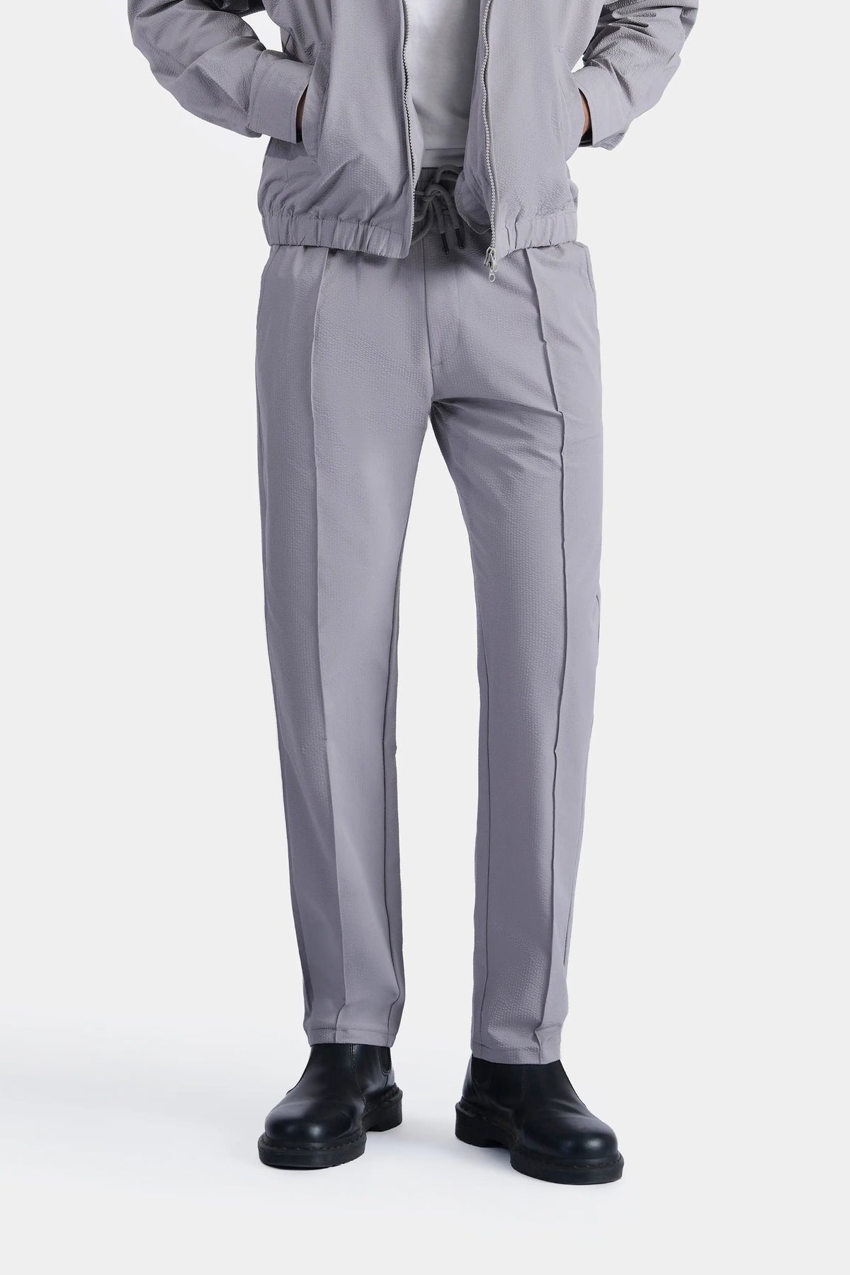 Light grey seersucker trousers with elastic waistband and side seams