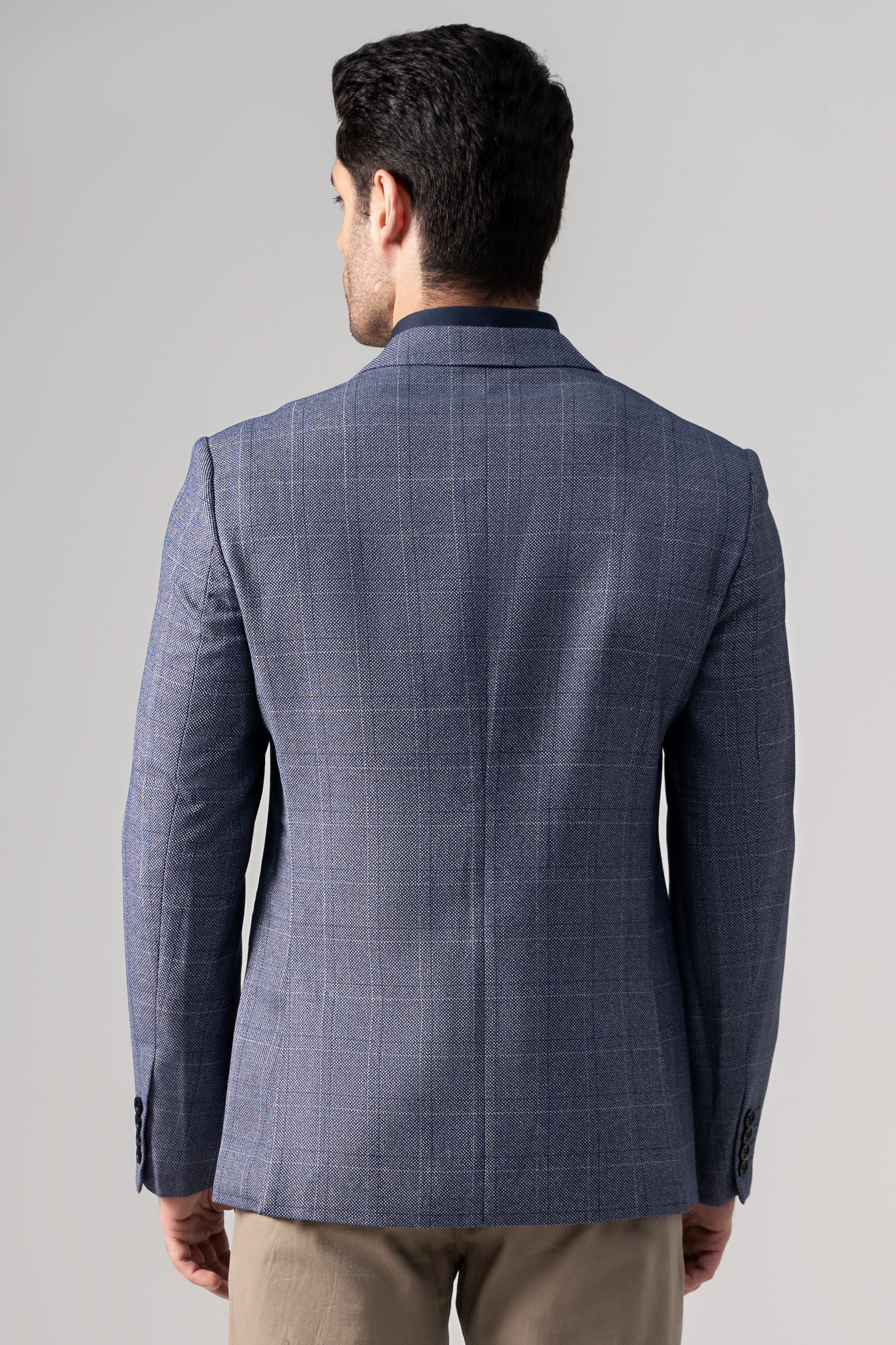 Men's blue casual coat back view with center seam and notched collar