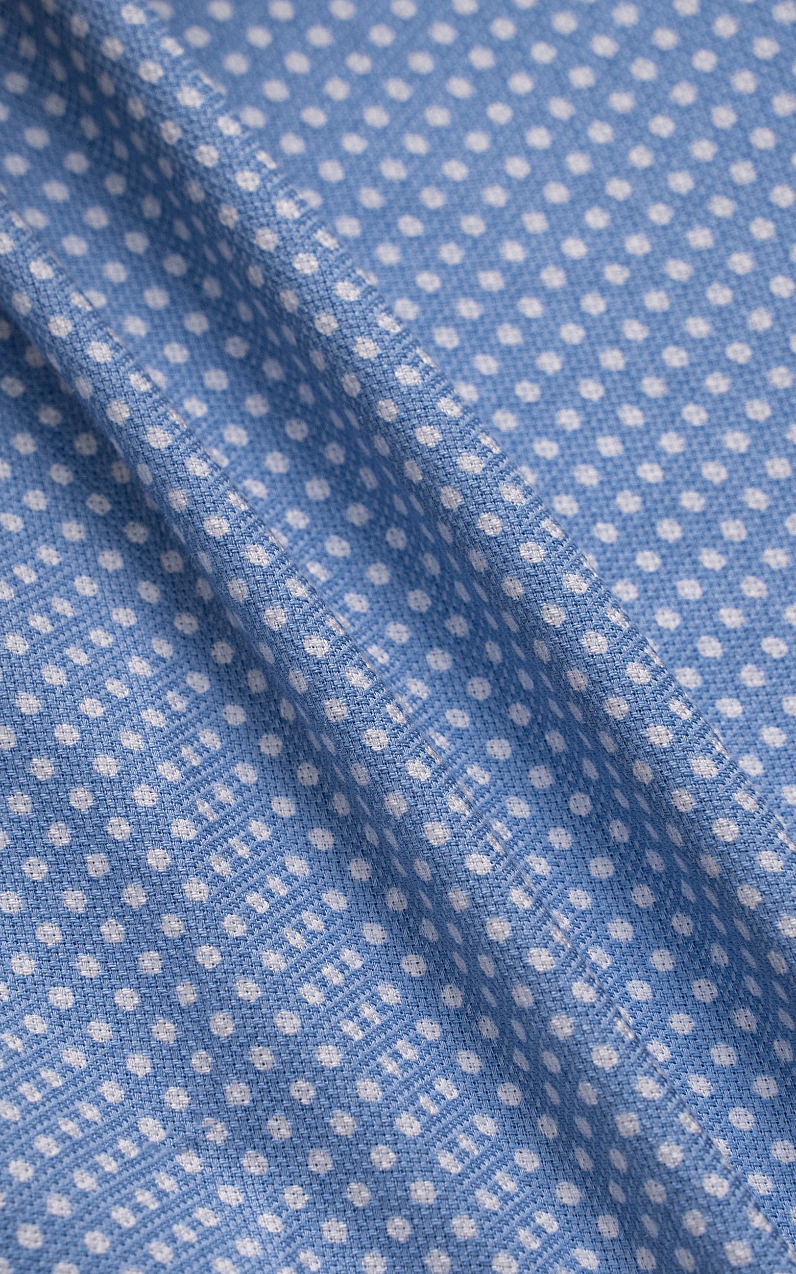 Blue fabric panel with repeating small white dots