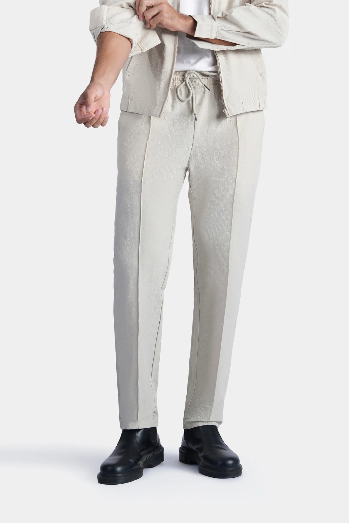 Beige seersucker trousers with drawstring and elastic waistband, side pockets