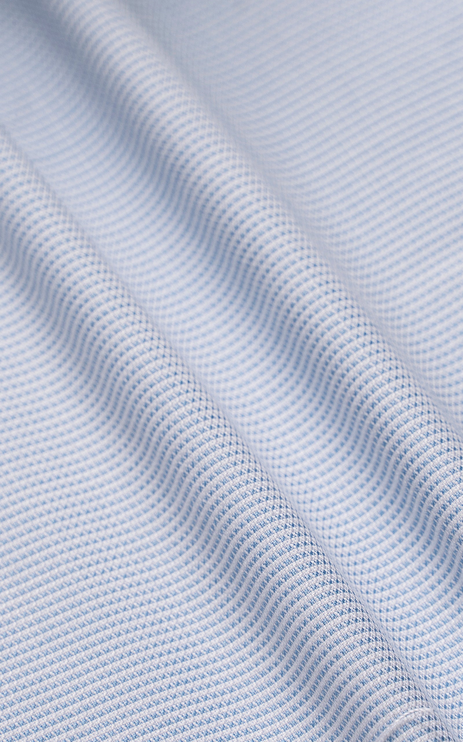 Light blue button-up shirt fabric with fine textured weave