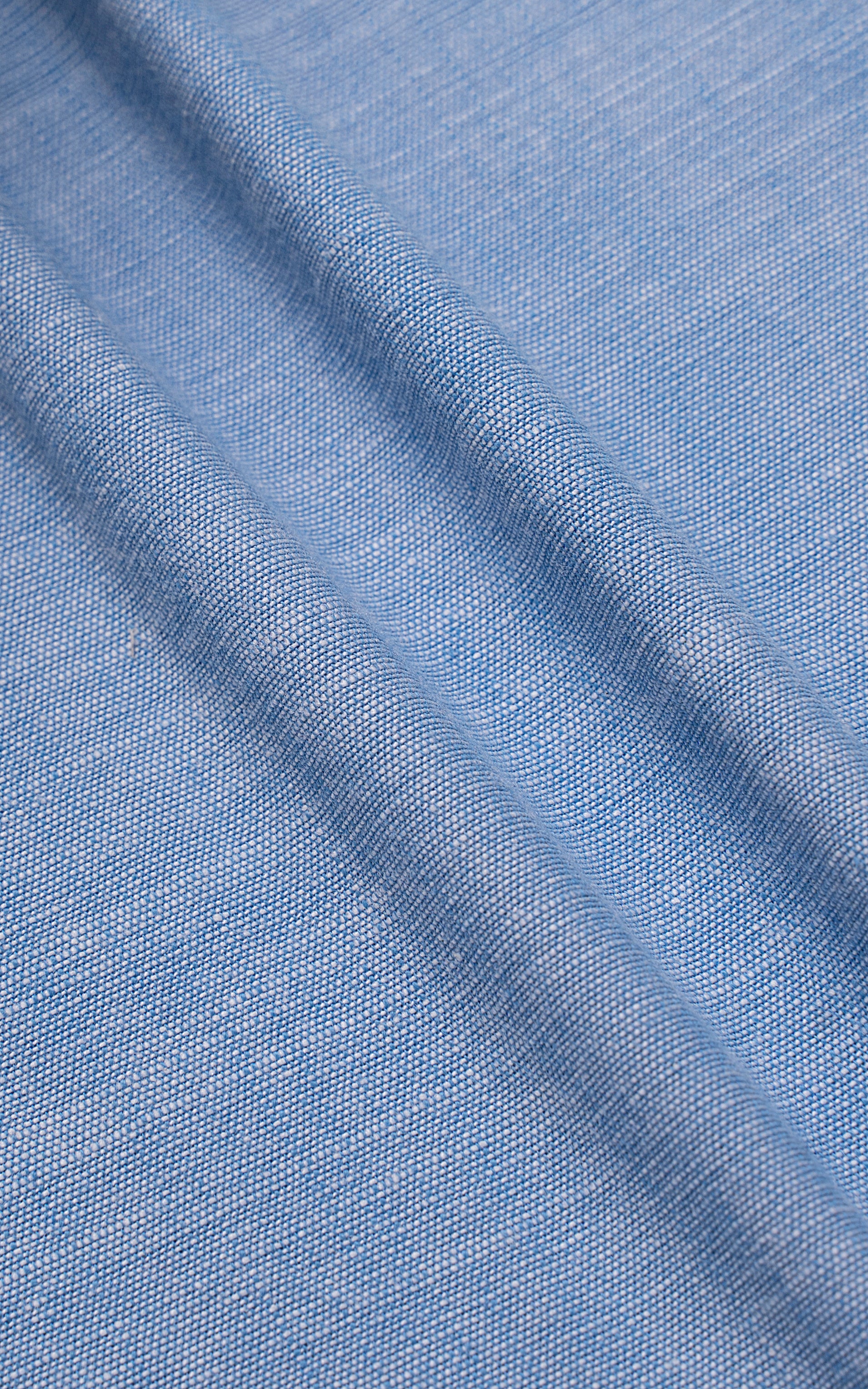 Blue textured fabric with subtle woven pattern