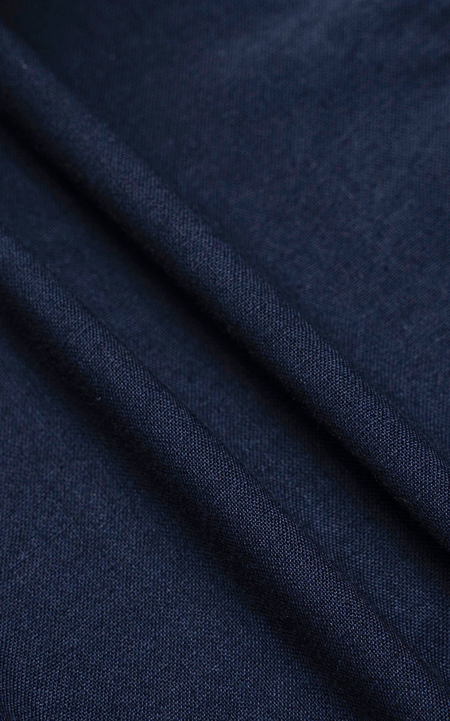 Navy shirt fabric texture with fine woven diagonal pattern