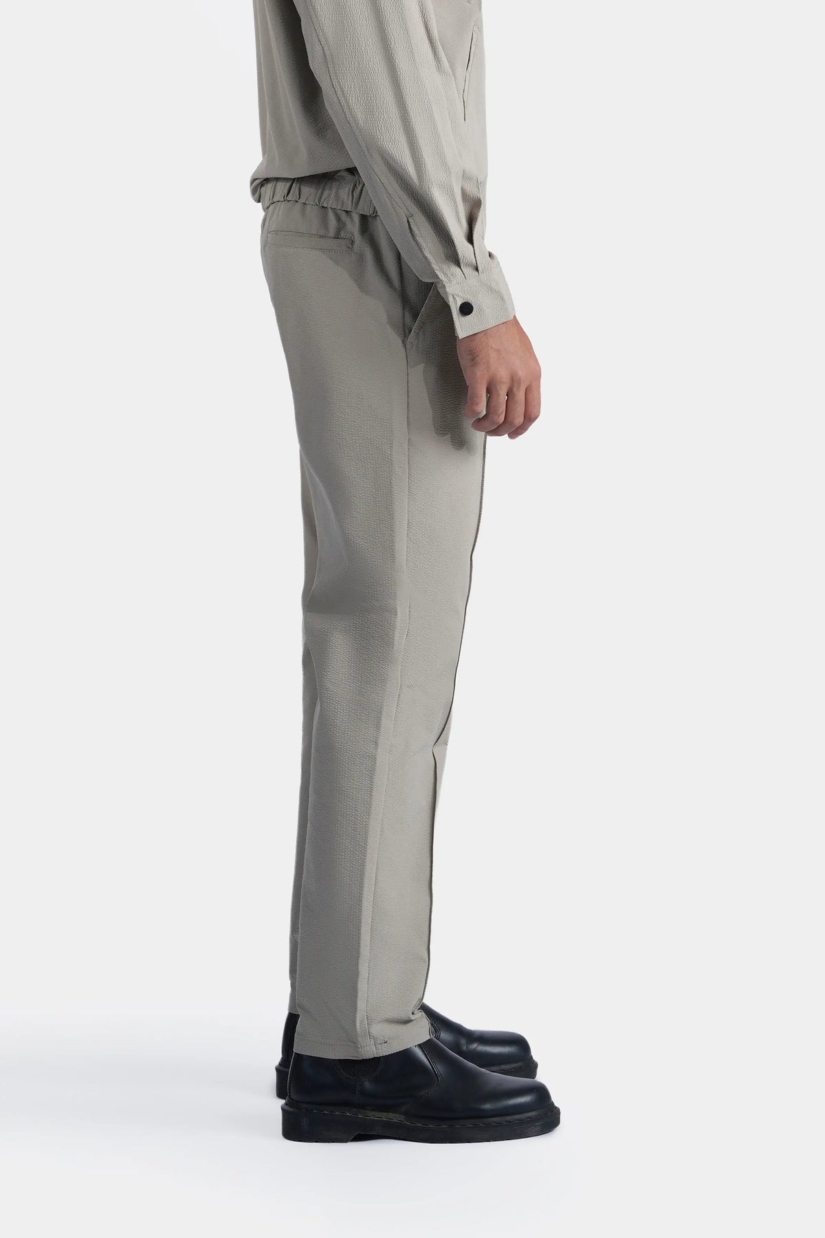 Smart Fit seersucker trousers, pistachio green, side view with cuffed hem