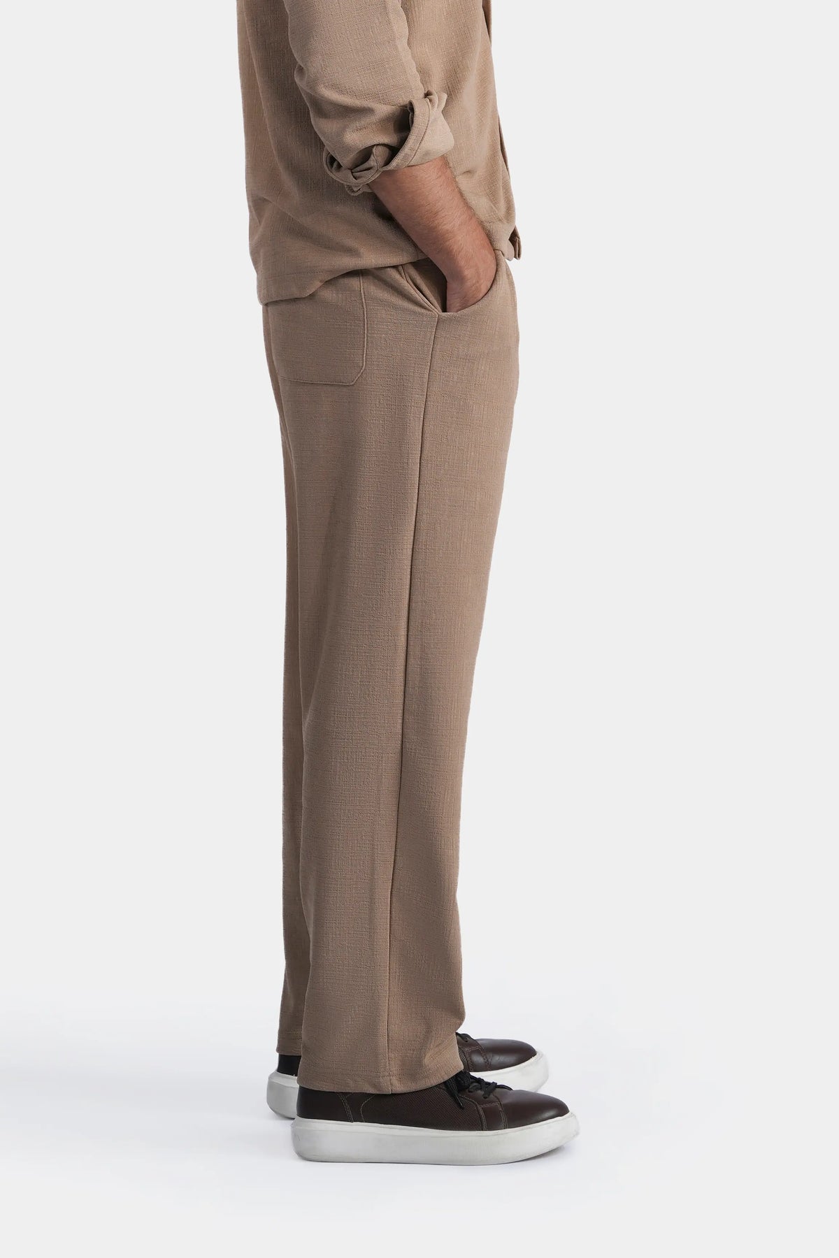 Khaki loose-fit trousers with side pocket seam detail, ankle-length hem
