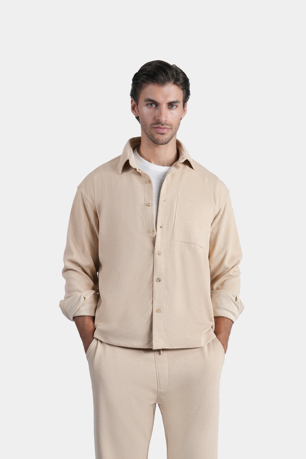 Beige textured casual shirt with regular collar, button placket, and chest pocket