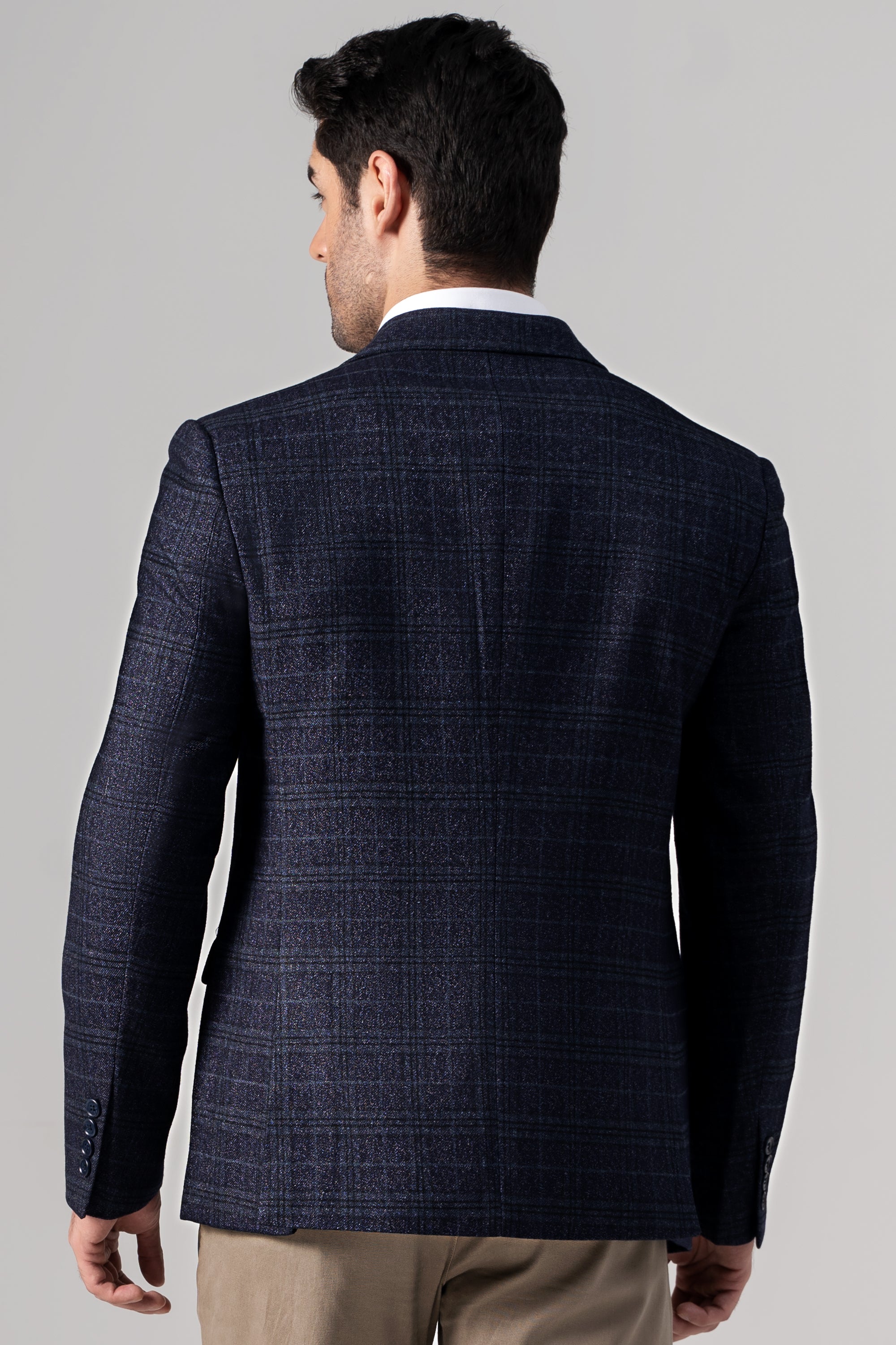 Navy casual coat back view with notched collar and textured fabric.